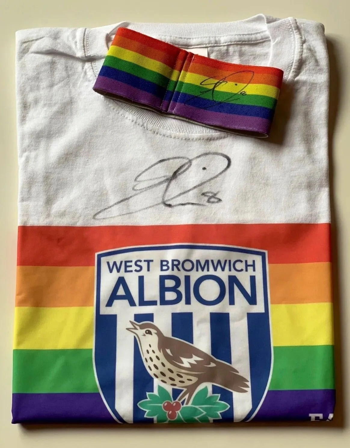 Bid Now for a Chance to Win a signed Armband and T-Shirt!