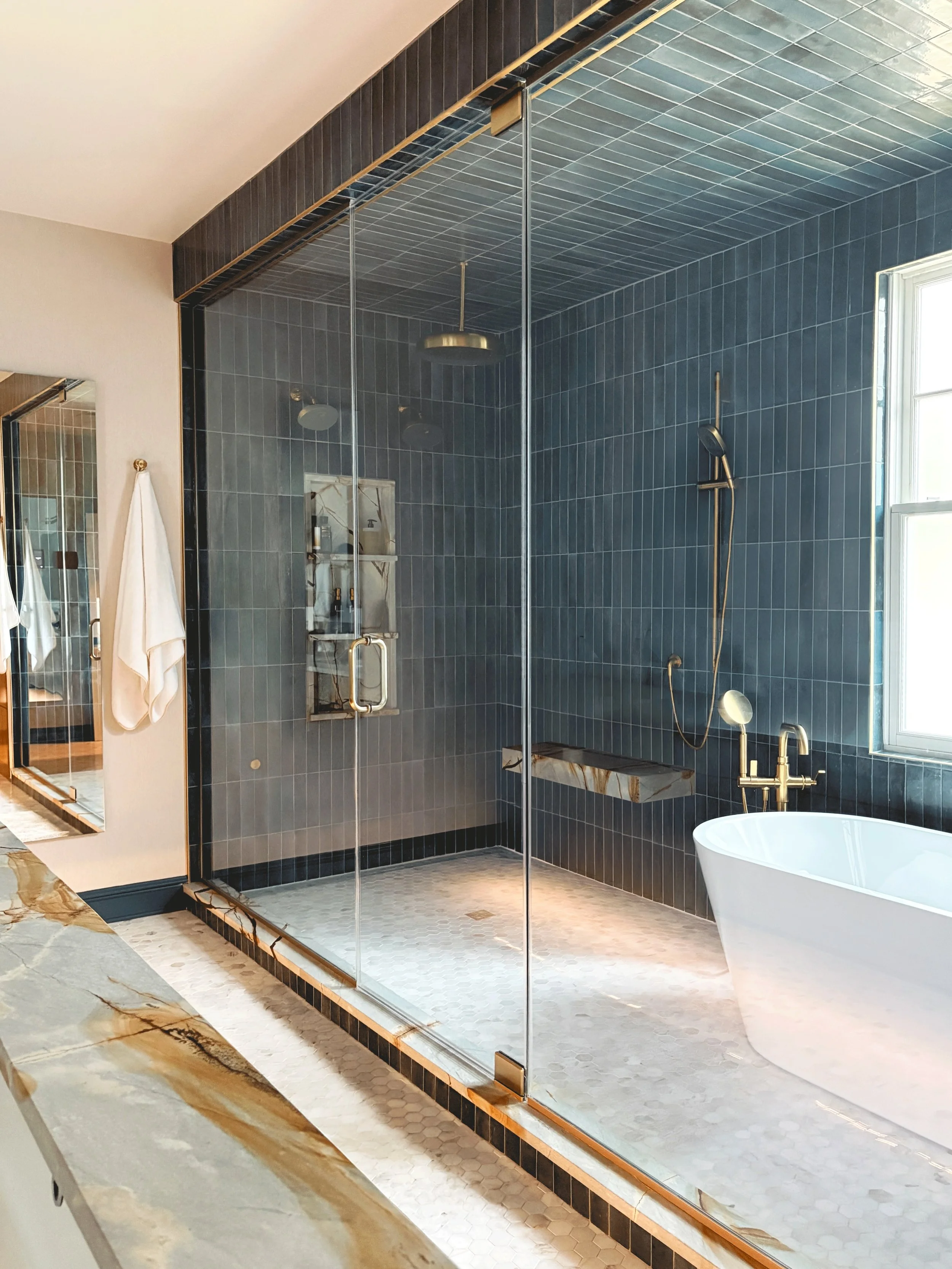 Big shower energy. 

We went big &amp; bold in this steam room/wet room design and the result. From the larger than life laying to the bold stone &amp; tile selections, this might just be one of my all time favorite spaces to walk into ✨

A portion o