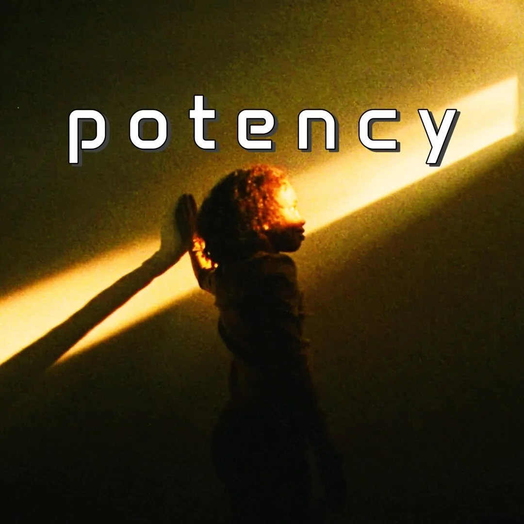 A woman with curly hair is standing in front of a wall with a bright diagonal light shining across it. She is touching the wall with her hand and looking at the light. The word "potency" is displayed over the image.