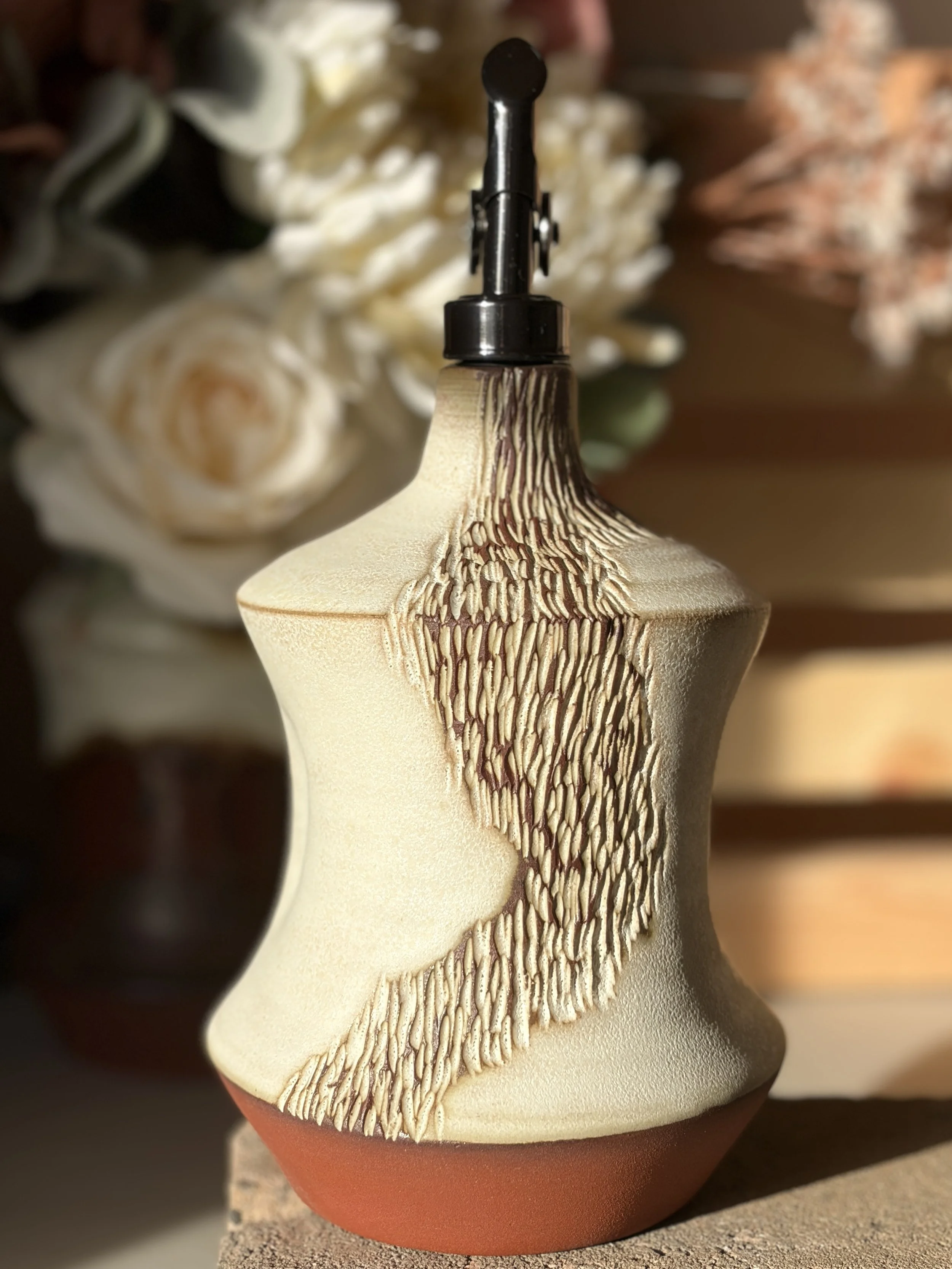 Exploring carved, path-like textures that reference natural trails and personal journeys.