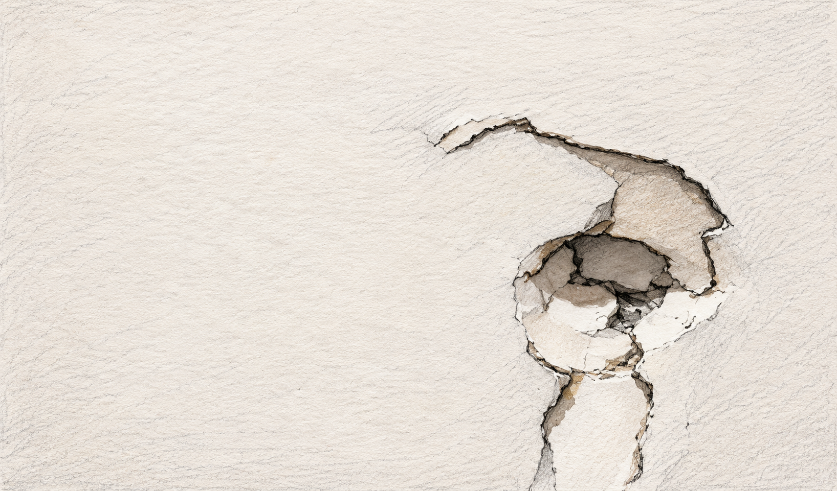 A close-up of a wall with a large, irregular hole that reveals the drywall and inner structure behind it.