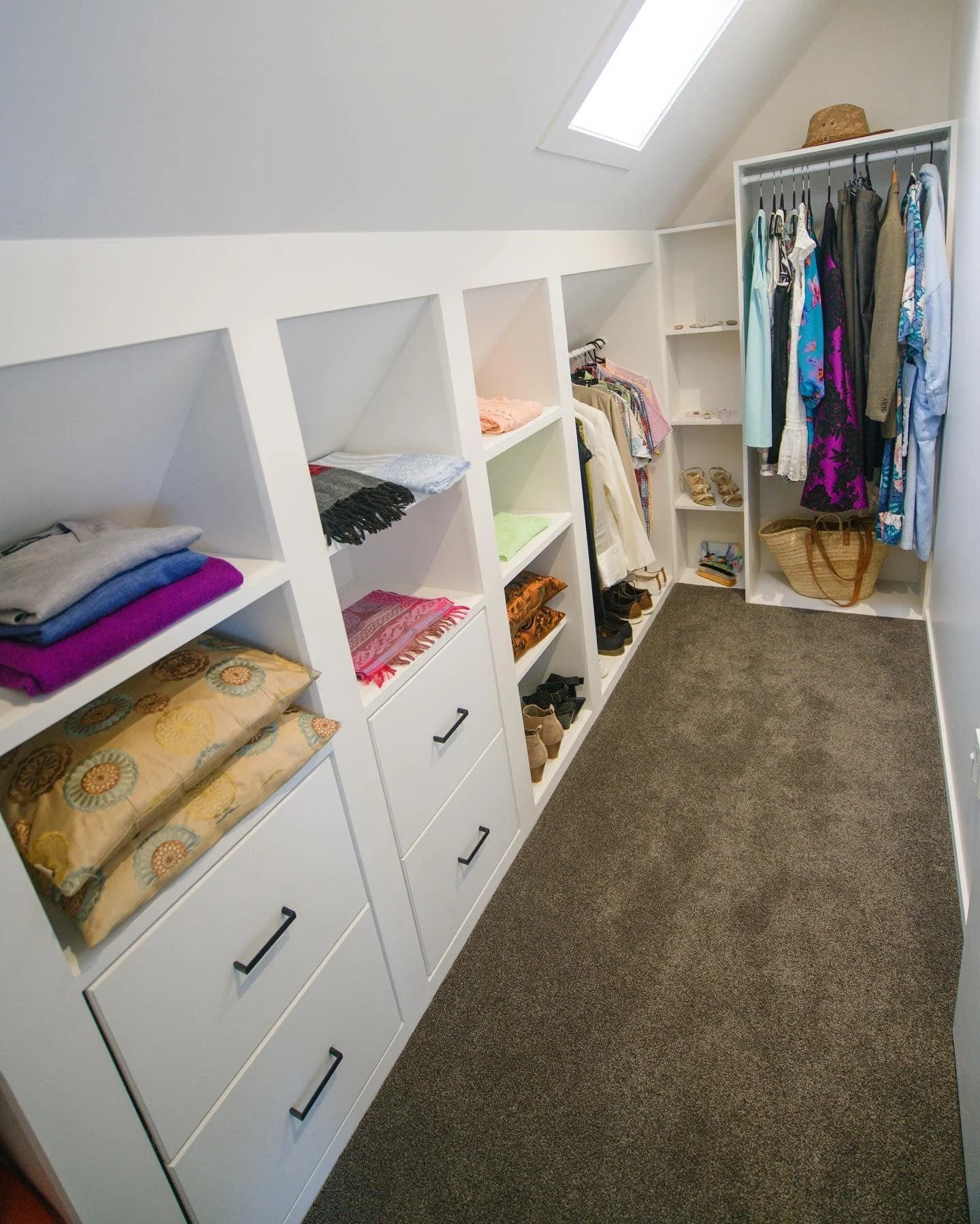 Custom walk-in wardrobe with built-in drawers and shelving designed and built by Capital G Construction and CGC Property Solutions in Tauranga