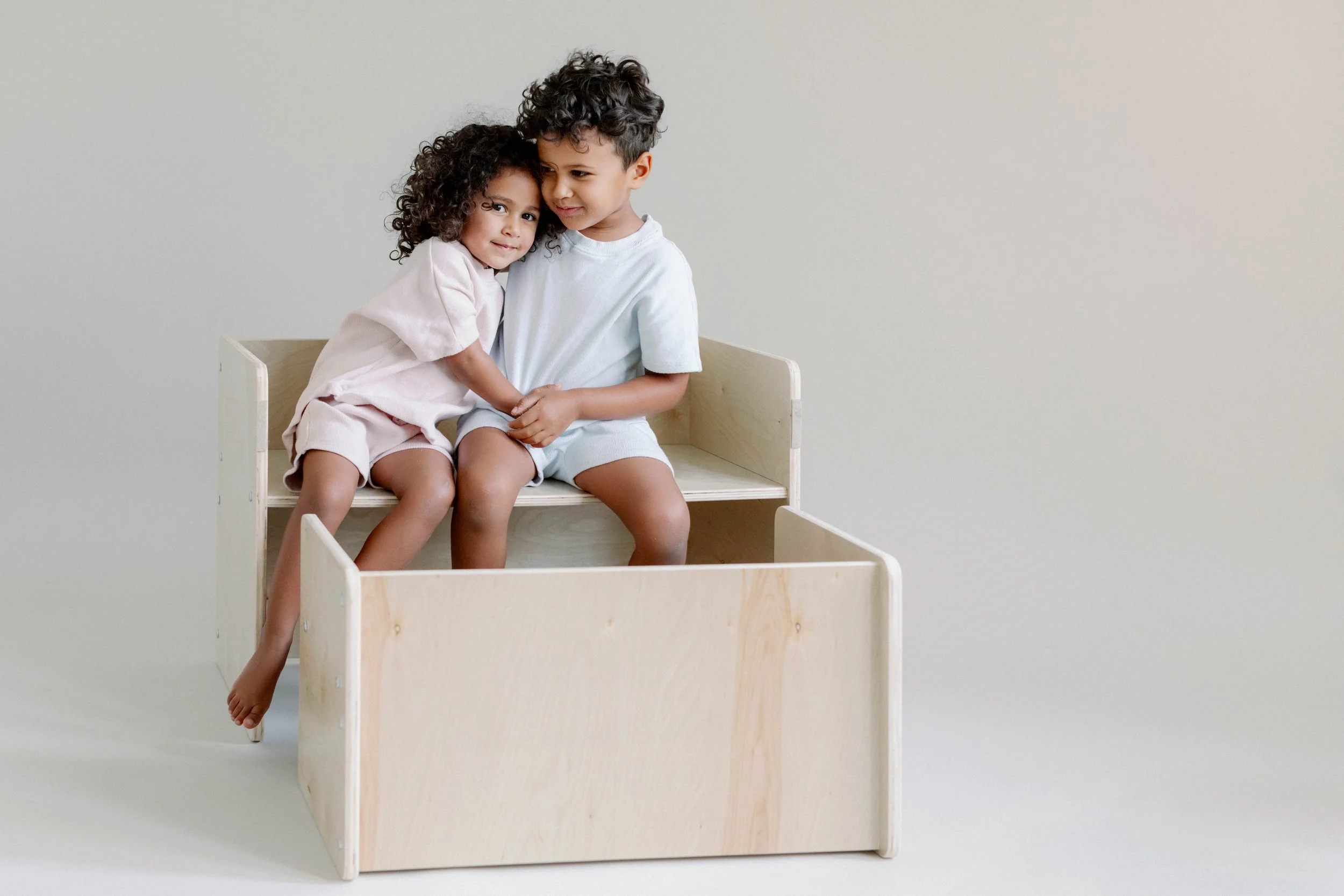 Natural, Montessori-inspired wooden toy bench by Calmatco, showcasing warm wood tones and clean, functional design.