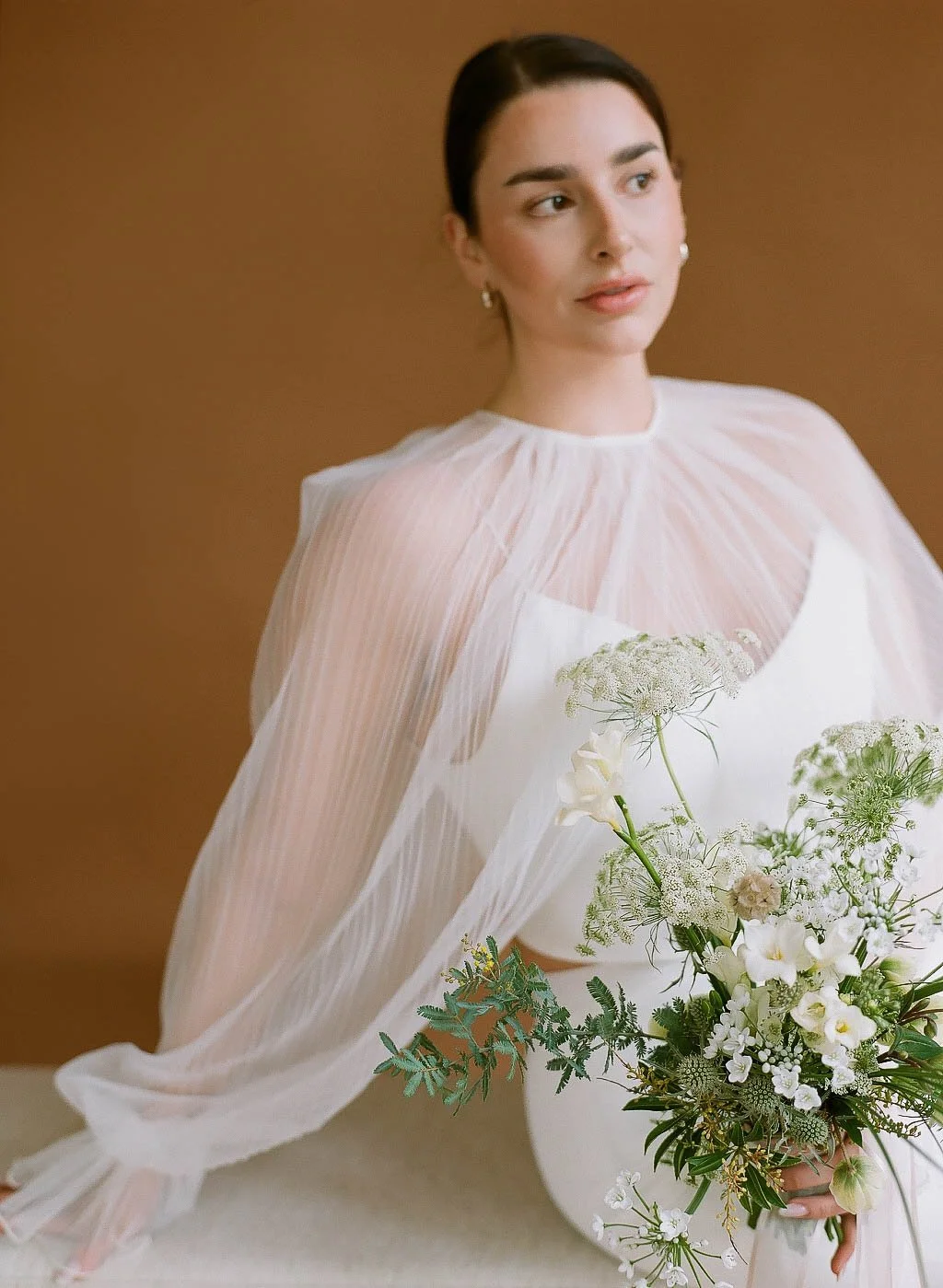 Soft, earthy bridal portrait with natural floral elements by Neve Floral and modern styling by Tempête.