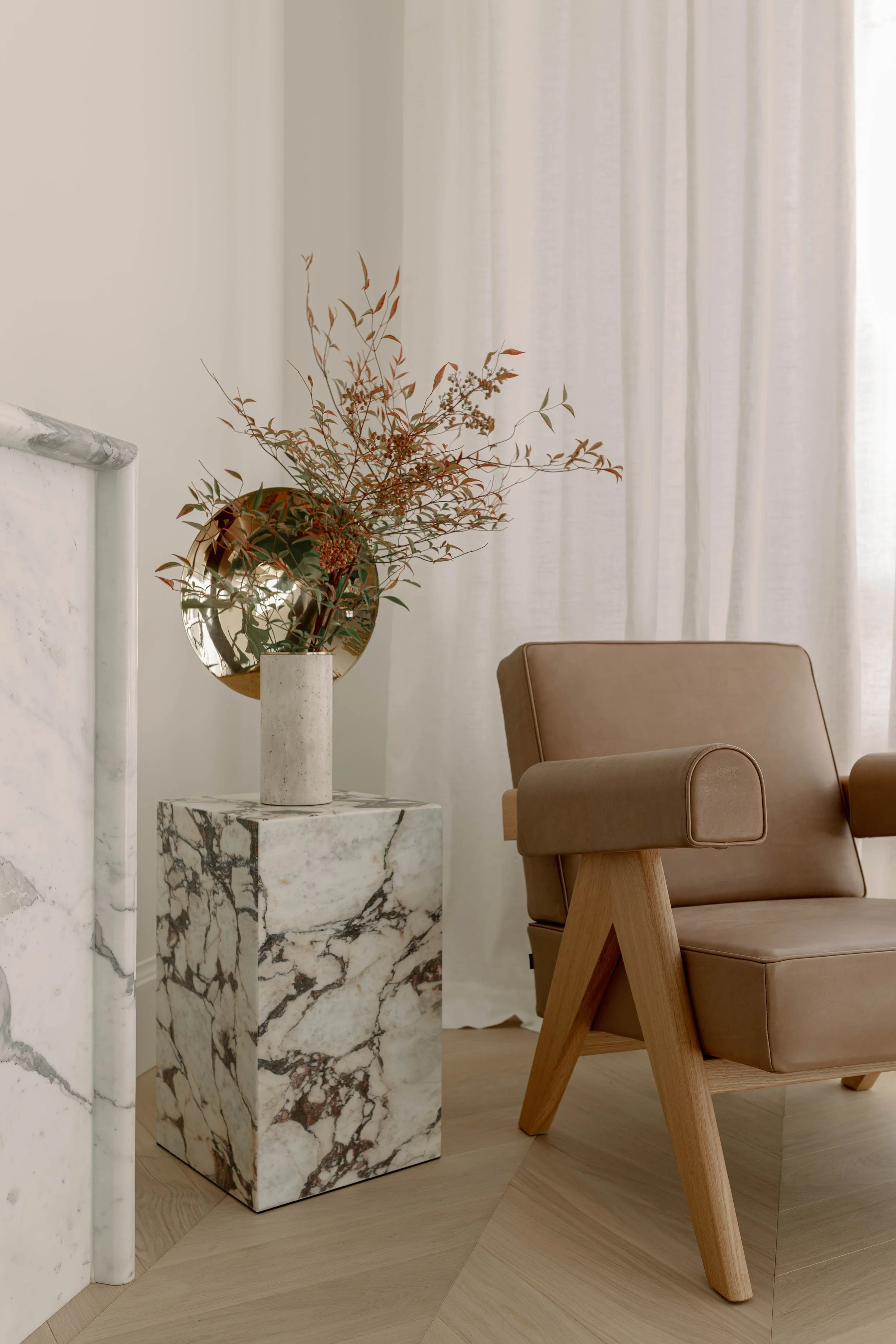 Light-filled, Parisian-inspired living space with neutral palette and classic detailing by Lauren Watson Studio.