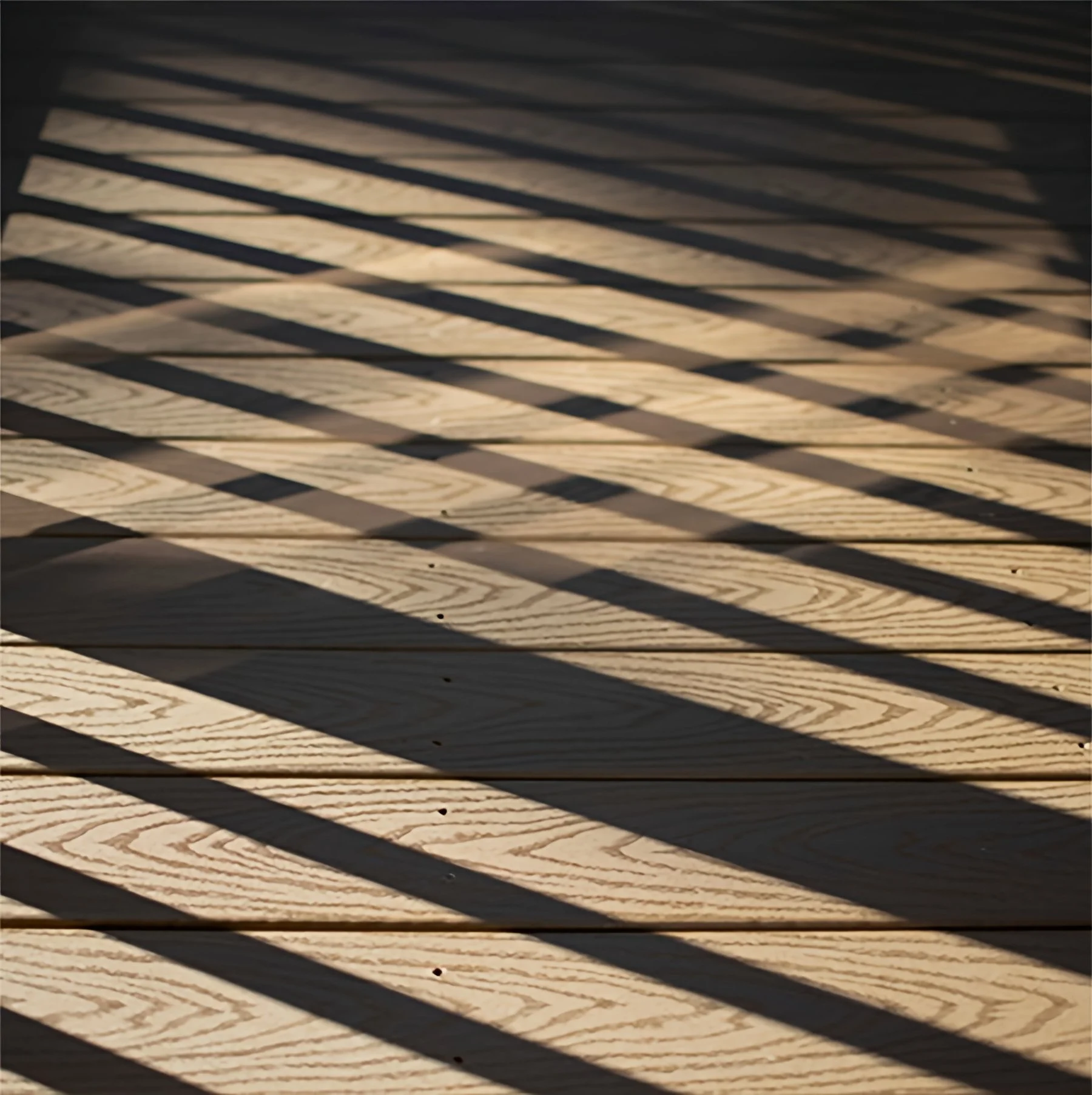 Light and Shadow Creating Art on Wood Floor