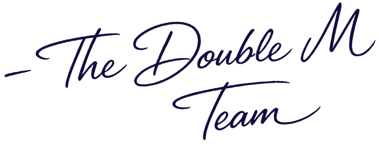 Text reading 'The Double M Team' in dark blue cursive font on a dark background.