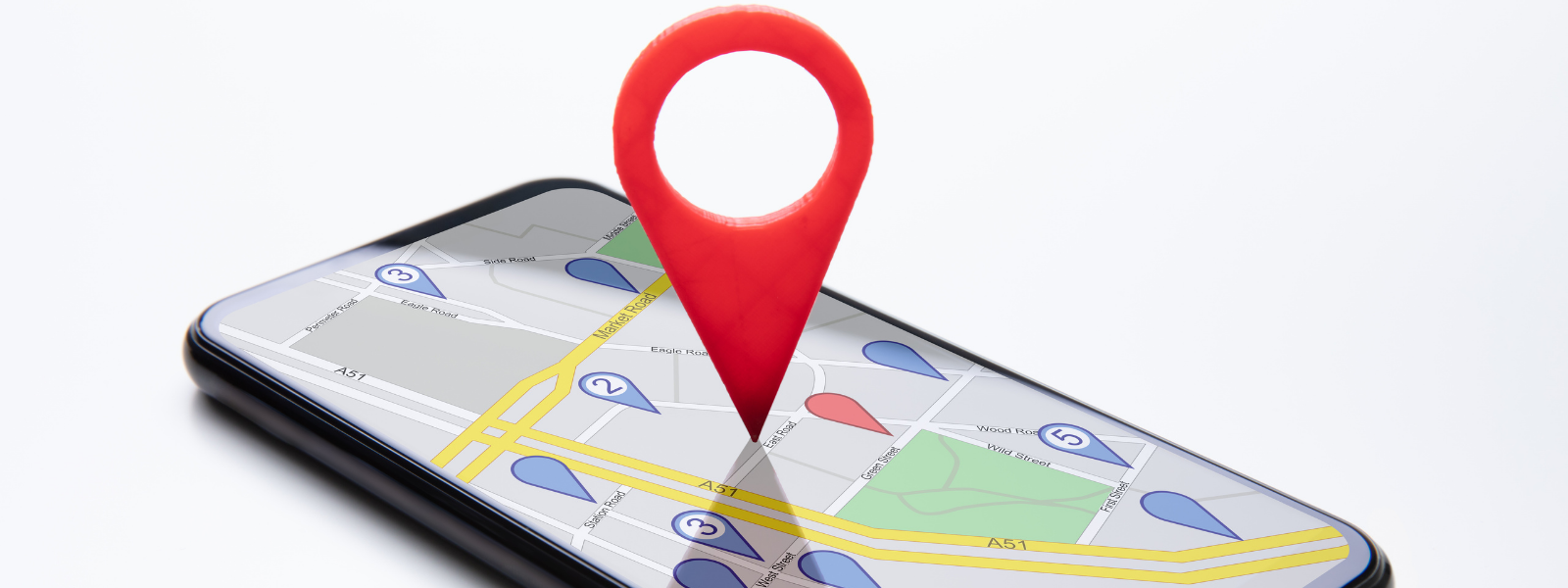 Smartphone showing Google Maps location pin representing Google Business Profile and Local SEO optimization for Orange County businesses.