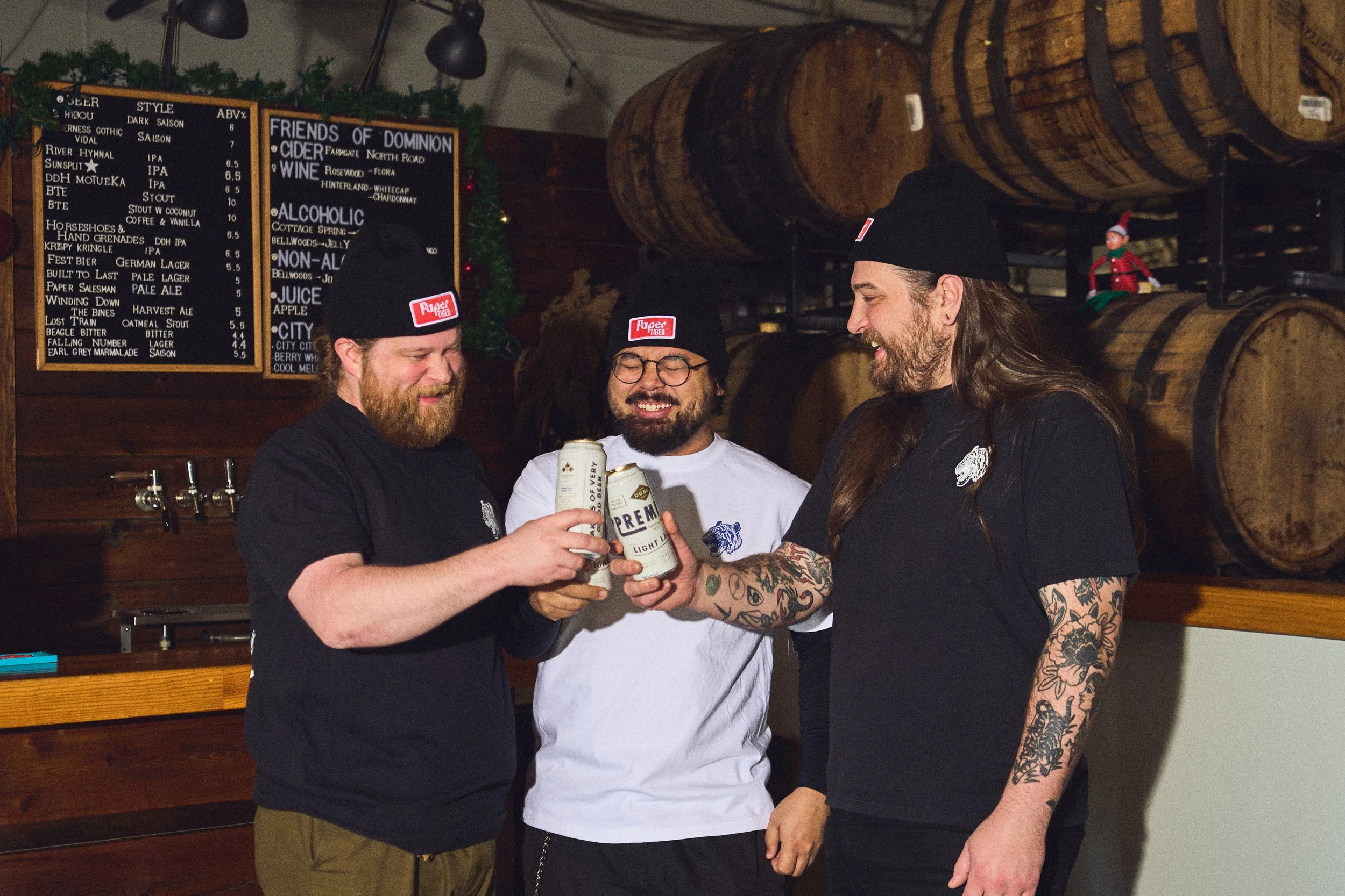 Charley Nelson of Paper Tiger drinking beer at Dominion City Brewing photo by Sarah Farmer of Gumption Studio, one of Ottawa's best food and cookbook photographers