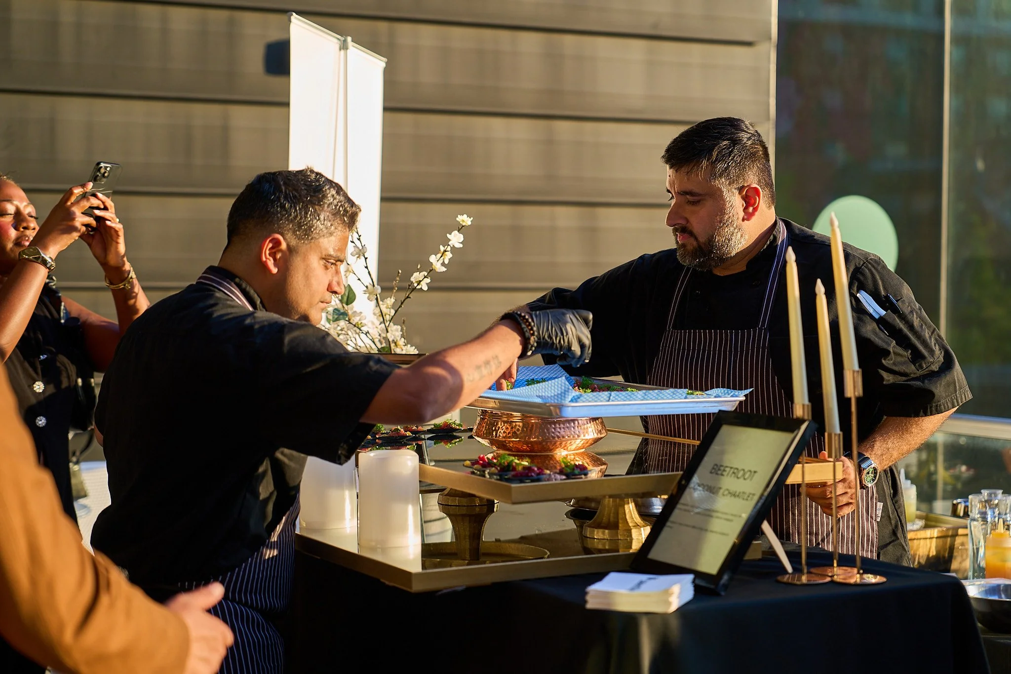 Chef Teegavarapu Sarath Mohan serving food at Harvest: A Feast of Fall. Photographed by Gumption Studio, Ottawa event photographer.