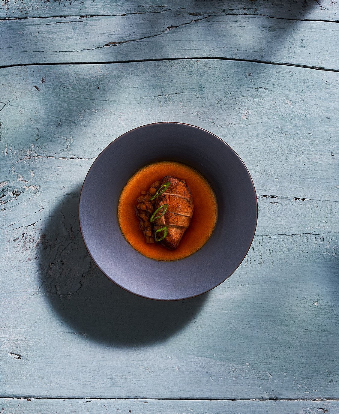 Quail Chawanmushi by Justin Champagne- Lagarde on a rustic light blue wooden table. Photographed for the Perch Cookbook by Gumption Studio, Ottawa Cookbook photographer.