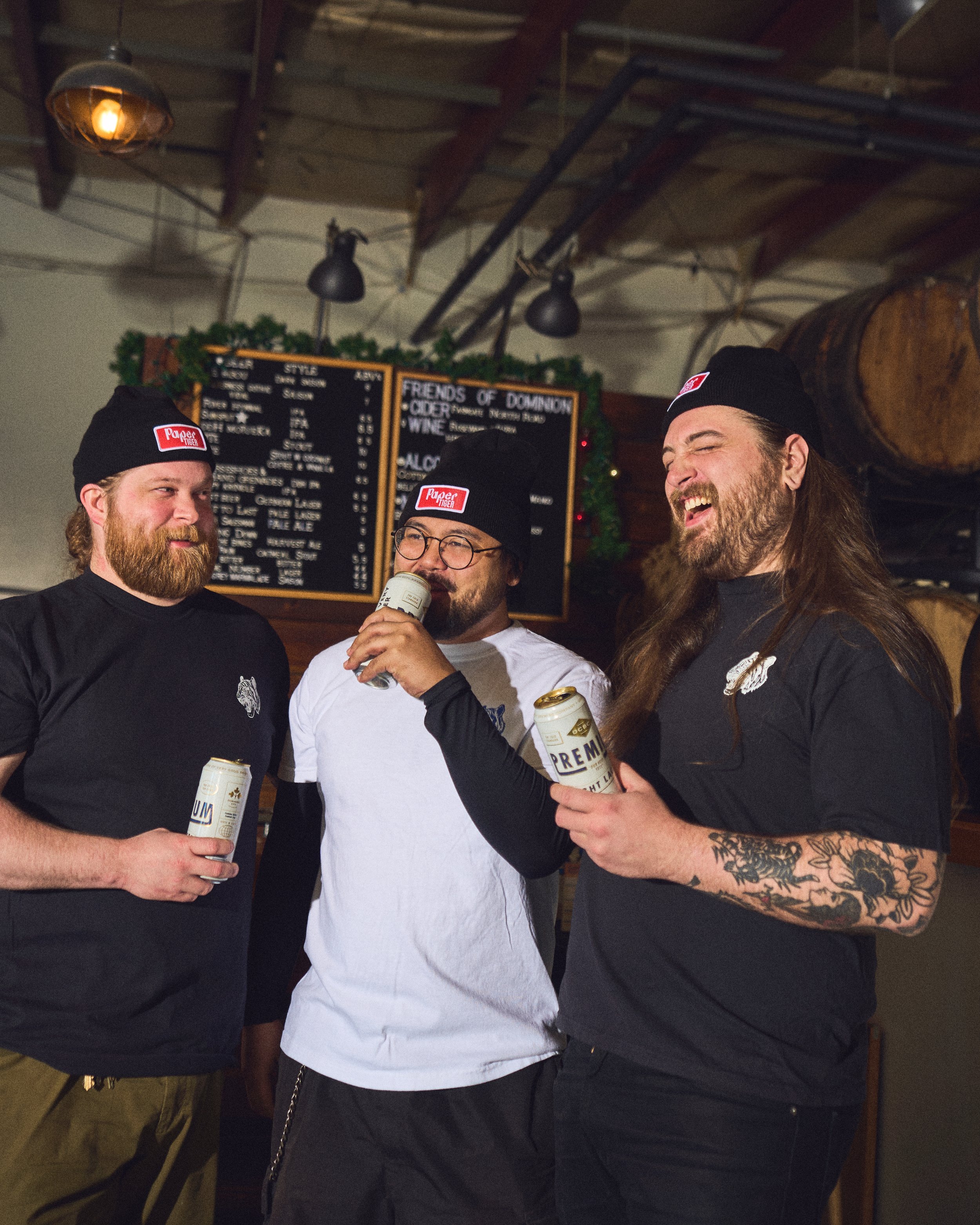 Charley Nelson of Paper Tiger drinking beer at Dominion City Brewing photo by Sarah Farmer of Gumption Studio, one of Ottawa's best food and cookbook photographers