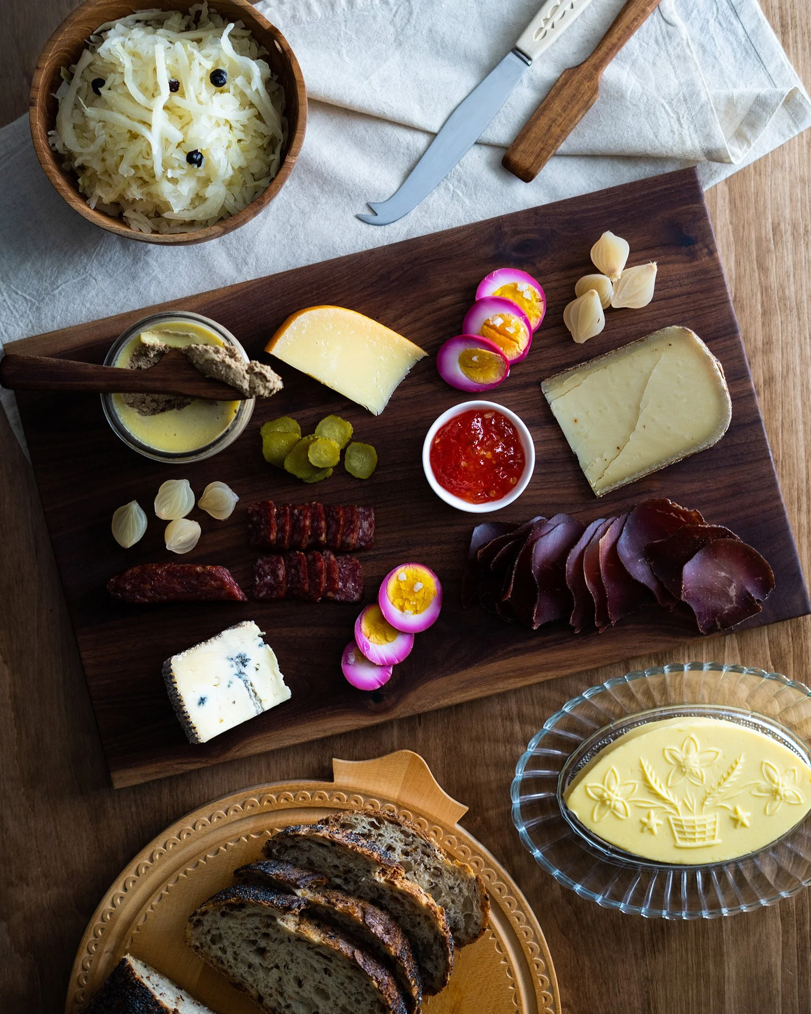 A charcuterie board with pickled eggs and sauerkraut by 
Ferme Rêveuse. Photographed by Gumption Studio, Ottawa food photographer. 