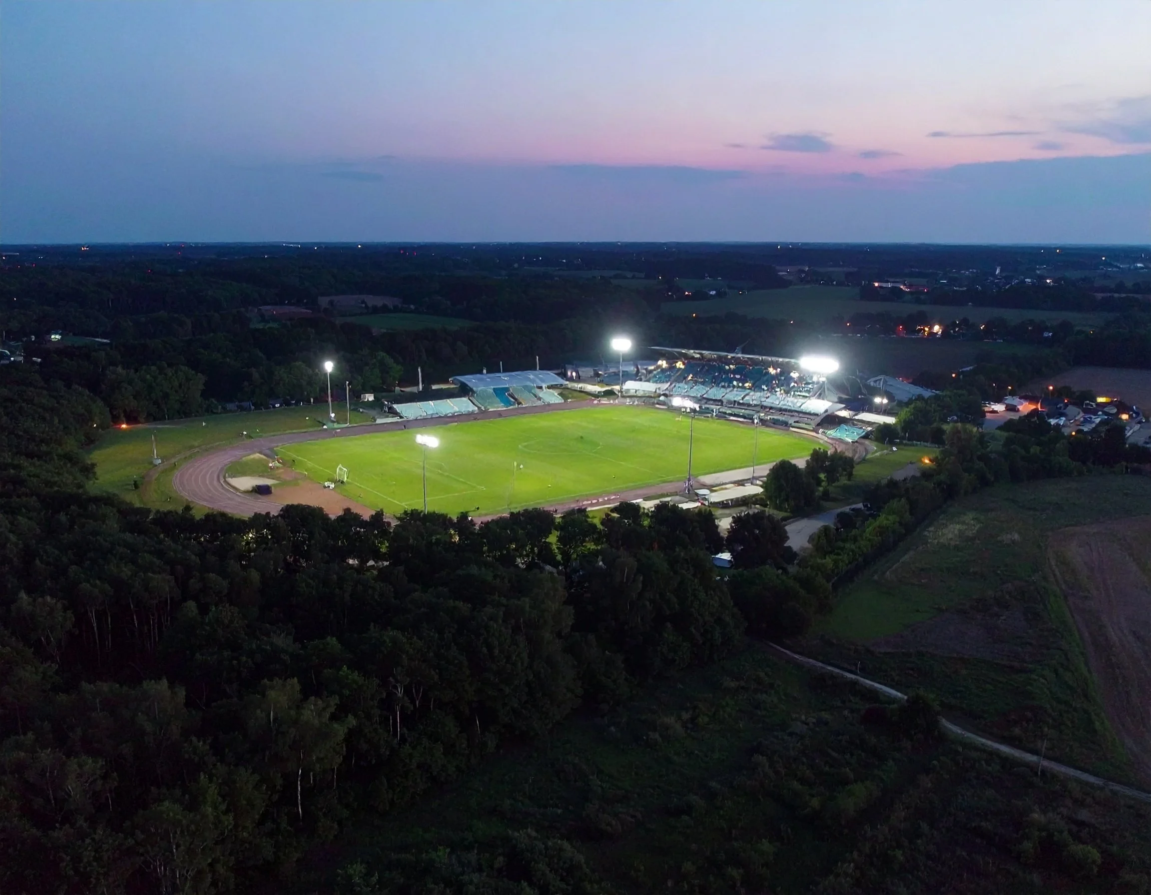 Firefly_aerial view of a sports field being lit up in the evening 477961.jpg