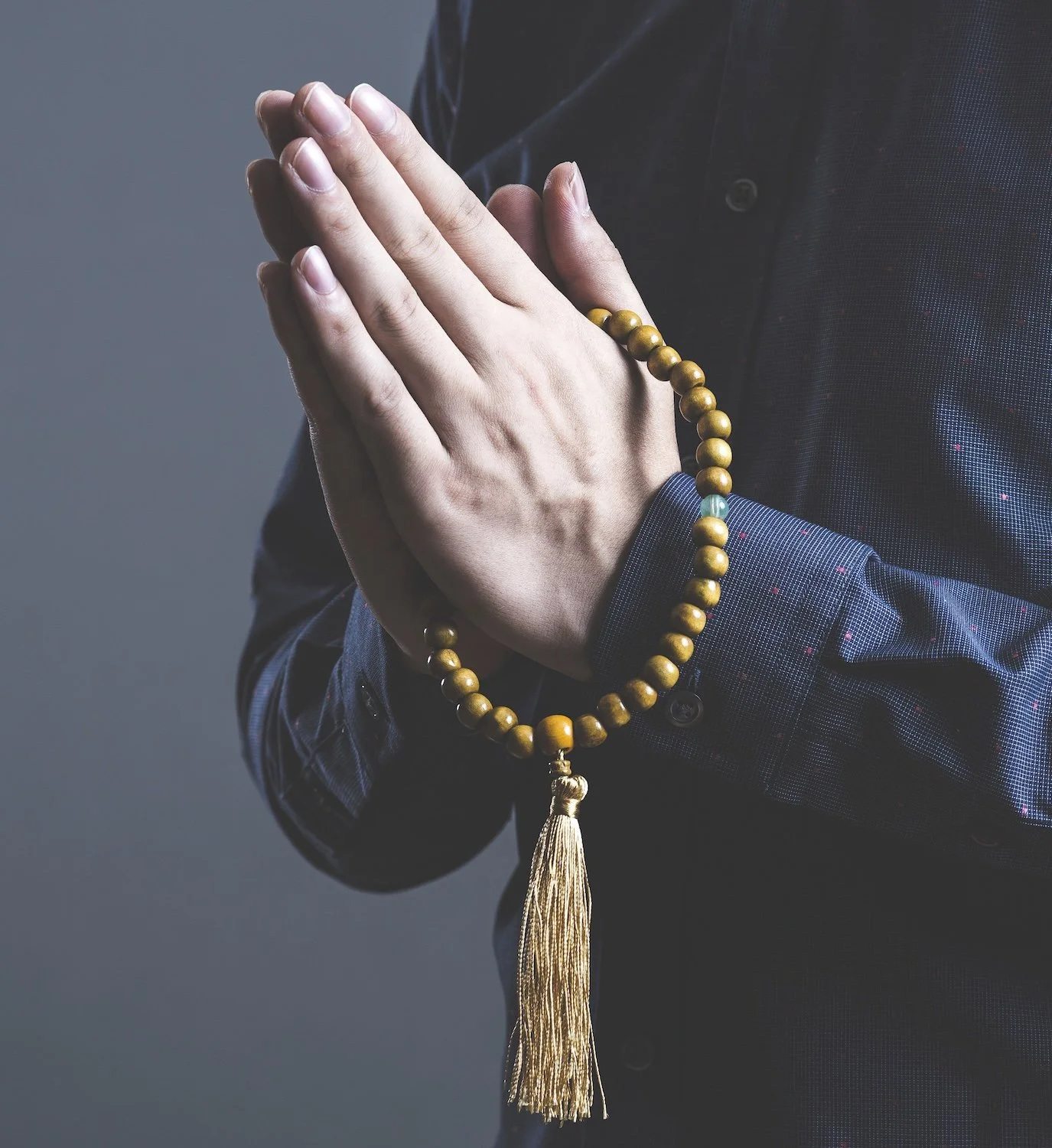 Hands clasped in prayer