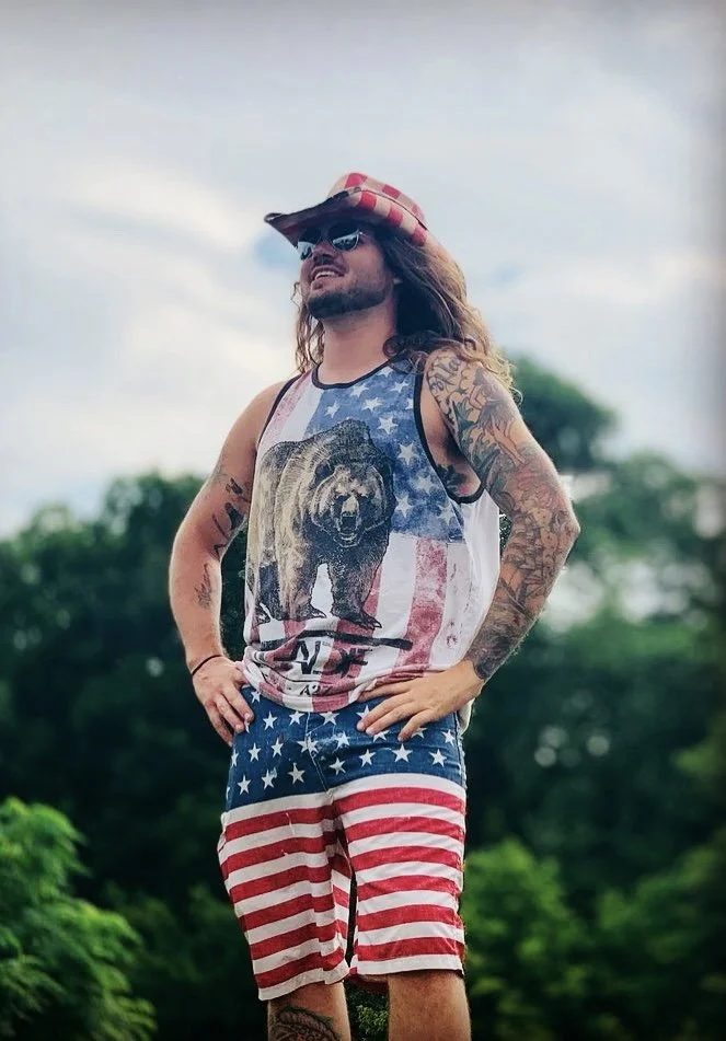 Tour guide wearing American flag clothing.