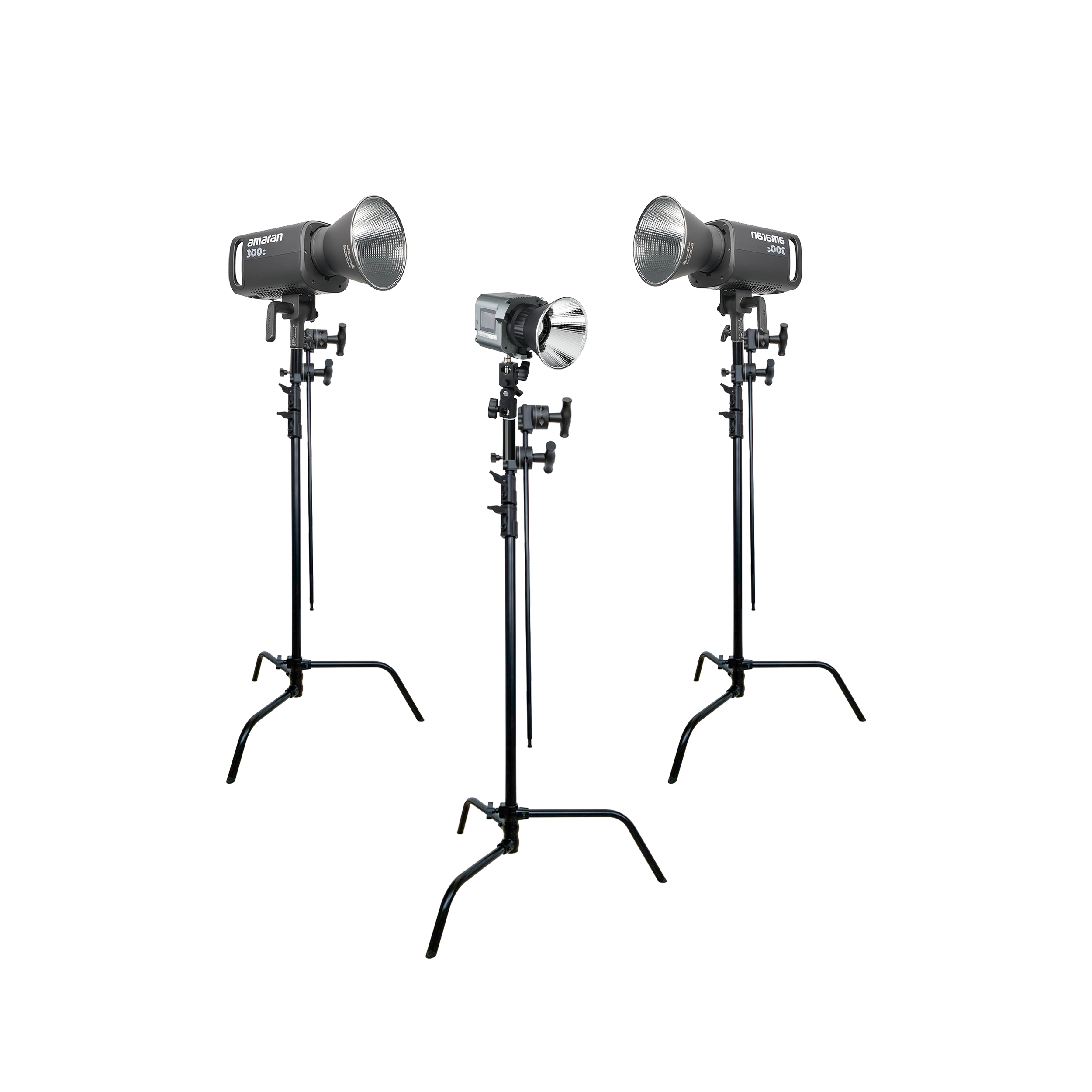 Three C-stands with film lighting on top