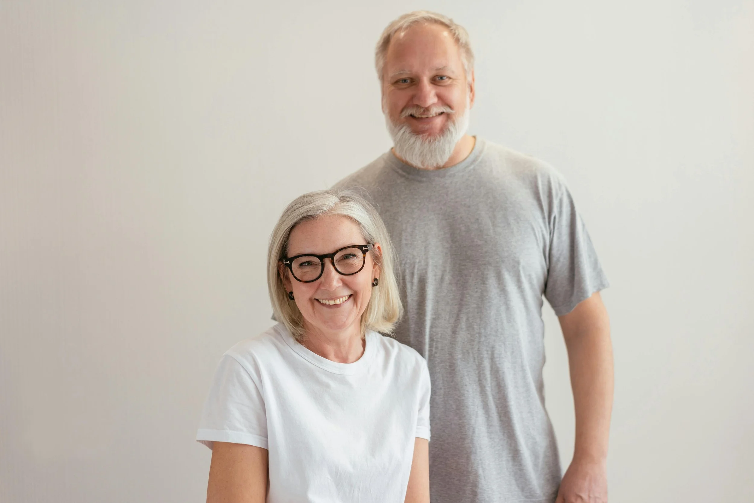 Smiling senior couple with healthy teeth after dental care