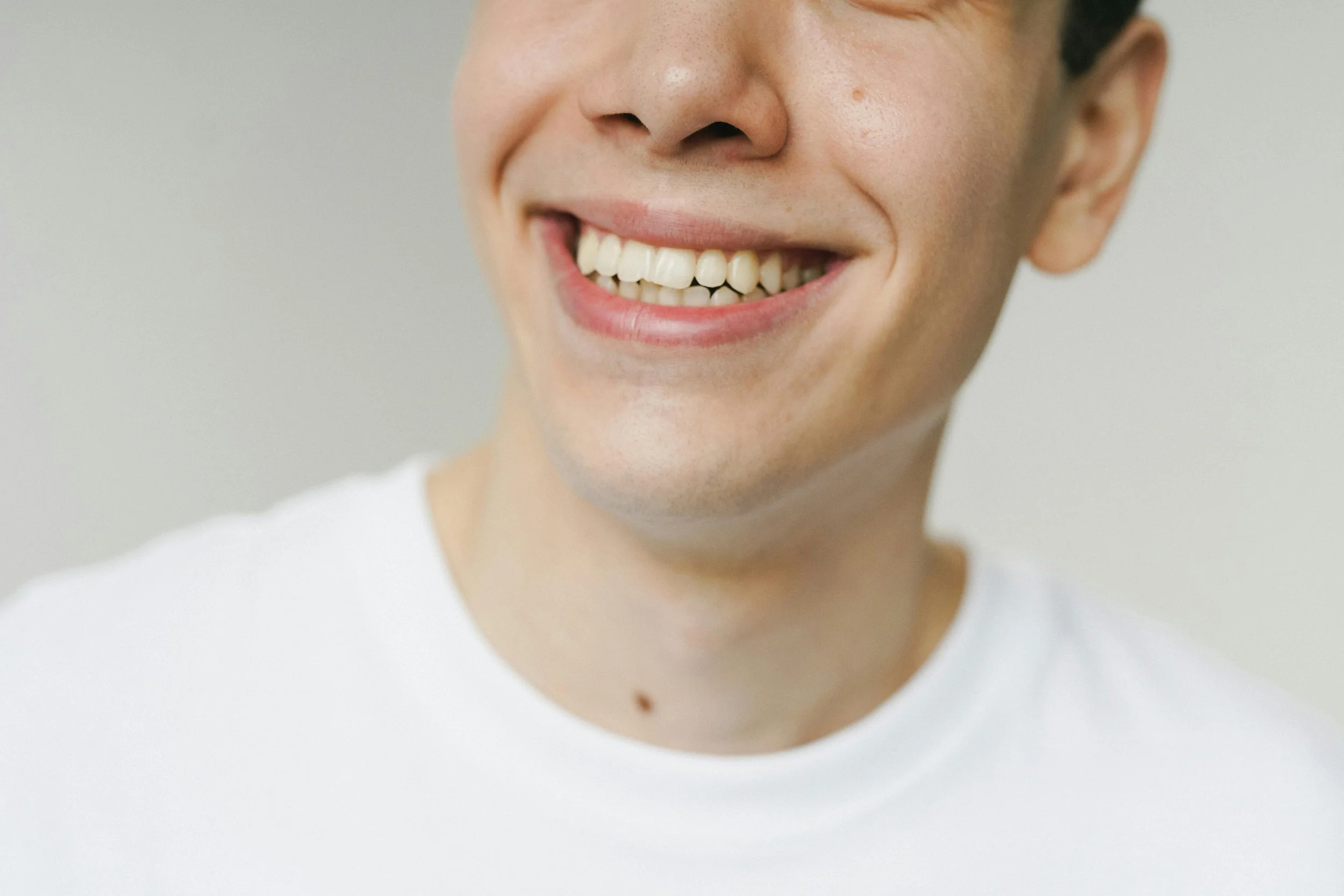 Close up of smiling mouth showing teeth.