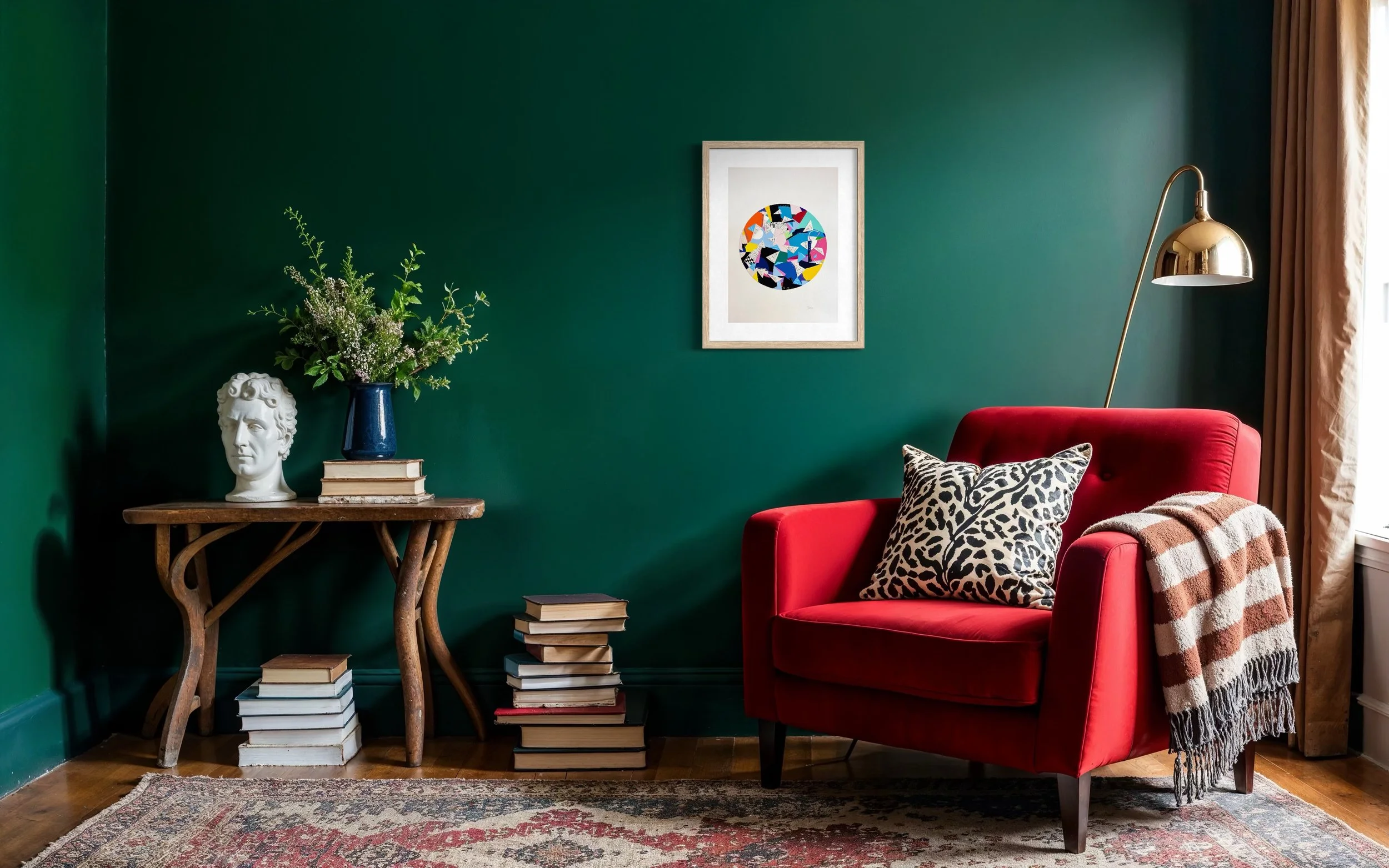 A Restless Centre, A3 abstract mixed media collage with a circular centre of coloured fragments and triangular pen drawings displayed framed on a green wall in a modern living room.