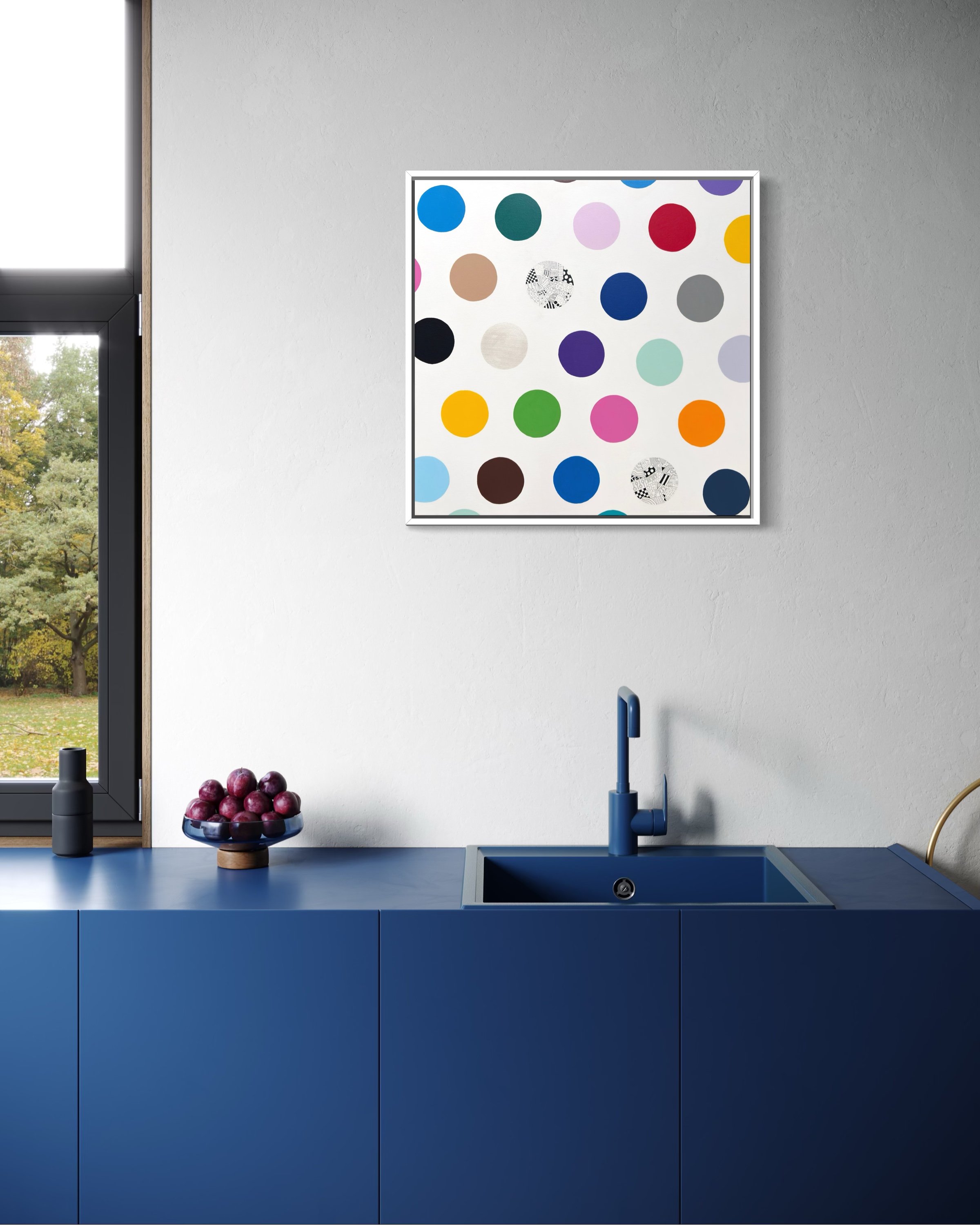 Spot The Happy Smile, original mixed media abstract on canvas with a white background and colourful spots, displayed in a modern kitchen with blue sink and benchtop.