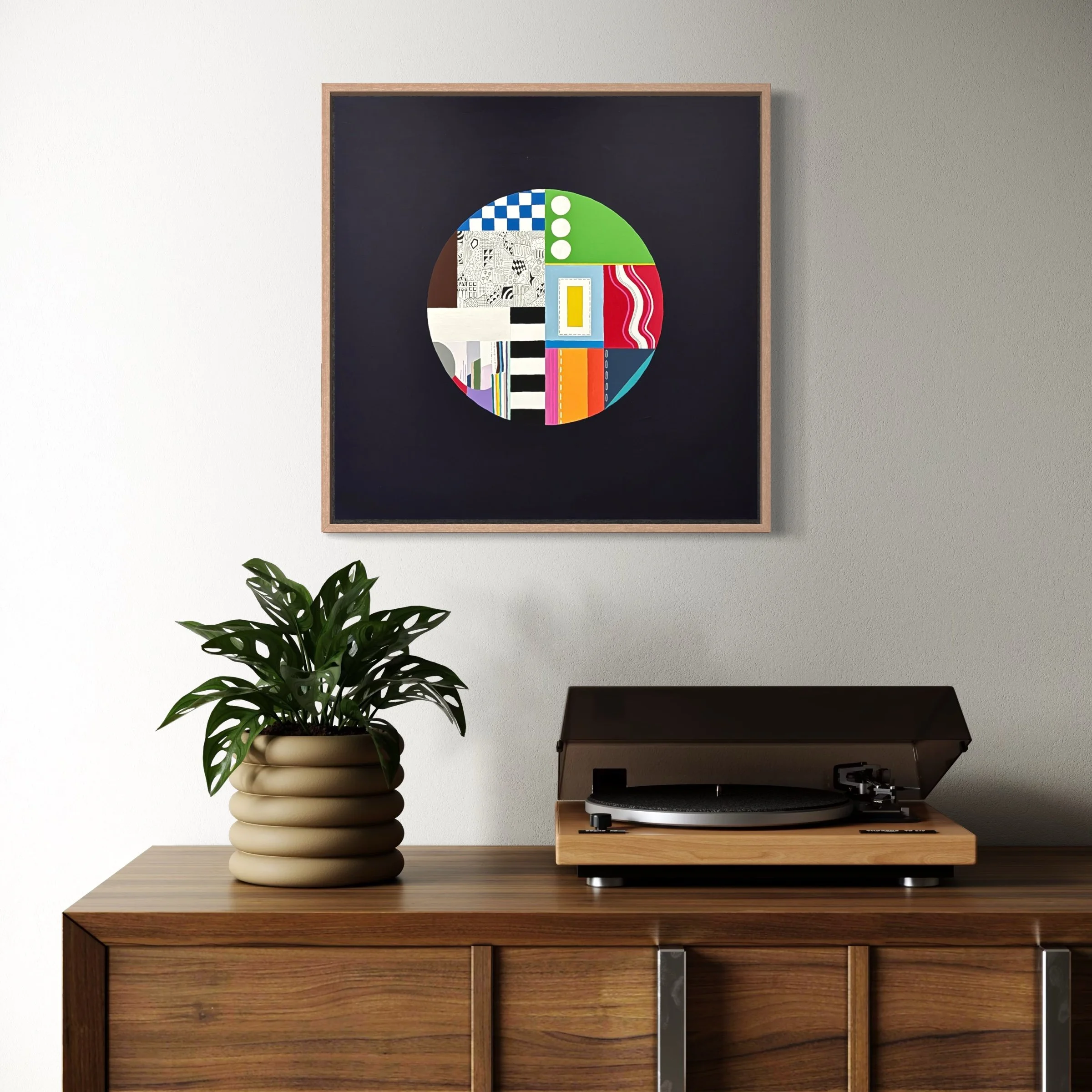 In a Roundabout Way, original mixed media abstract artwork featuring a circular composition, colour, patterns and geometric elements, displayed framed in a modern interior.