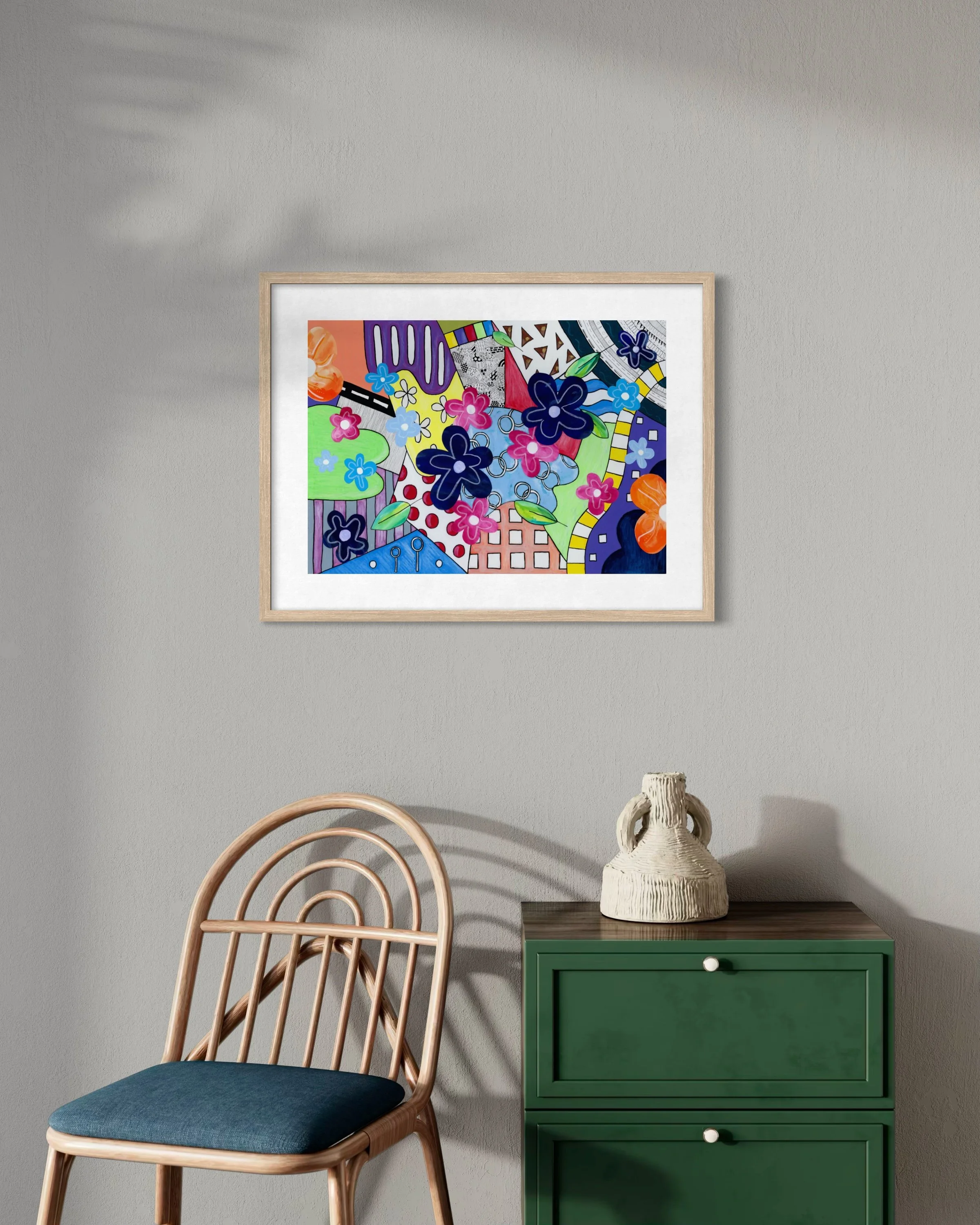 Spring Breeze Overland fine art print in a contemporary interior, featuring bold colour sections, collage flowers, a winding path, road-like form, and playful hand-drawn details.