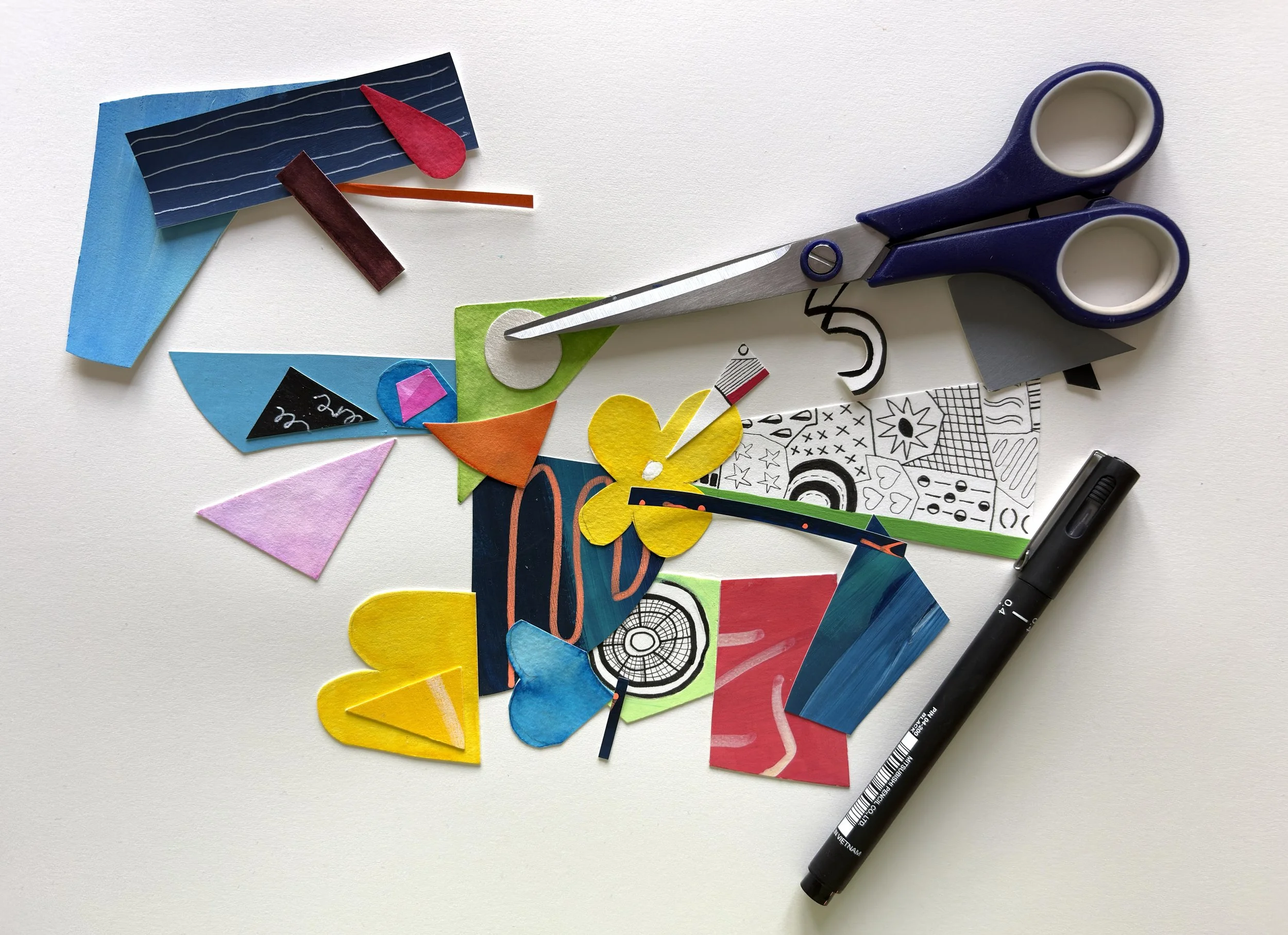 Some of Sam Jackson's collage pieces shown with scissors.