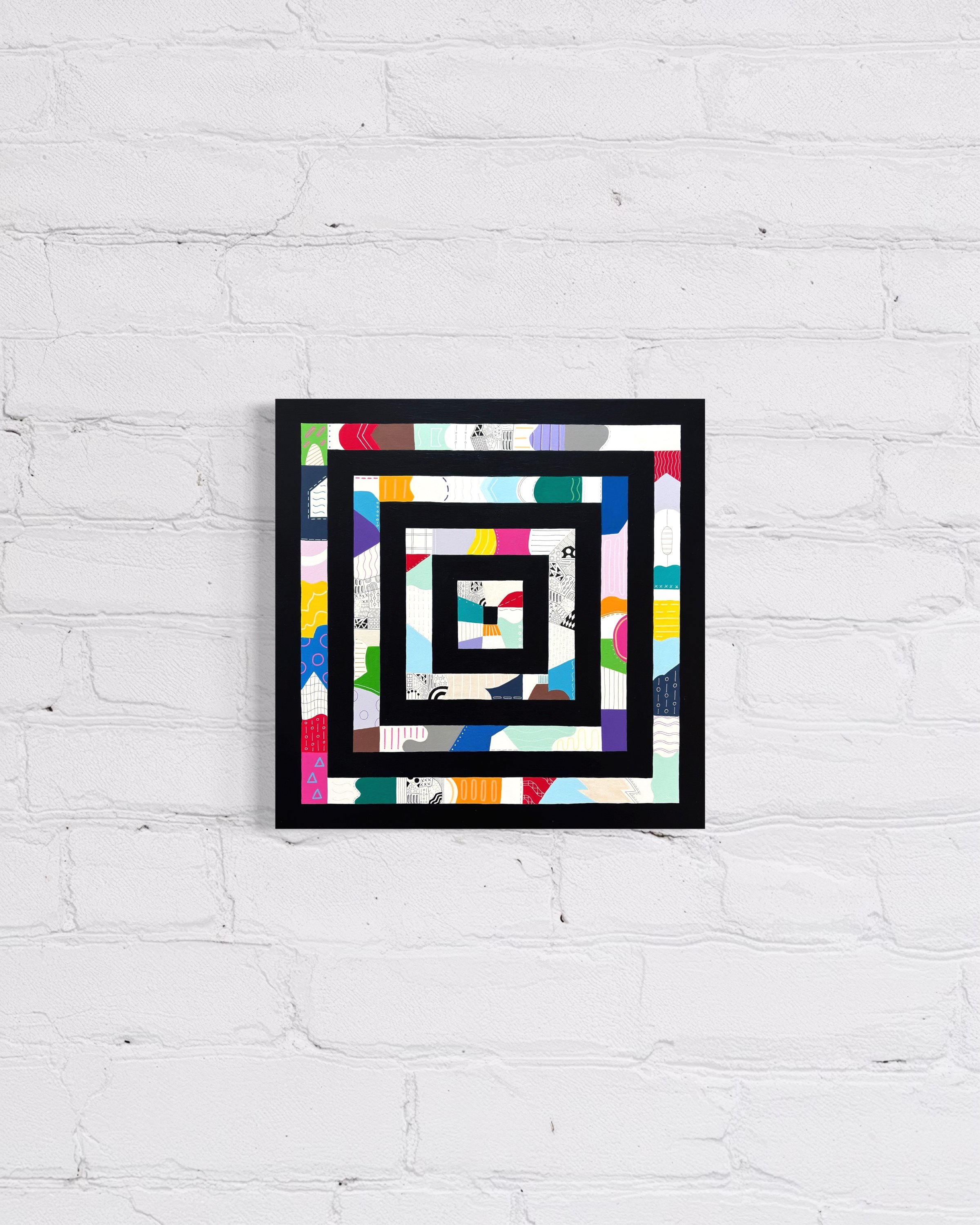 Freedom Within Boundaries, original abstract artwork on canvas featuring nested square frames in Paynes grey filled with bold, playful patterns and colour, displayed on a white brick wall.