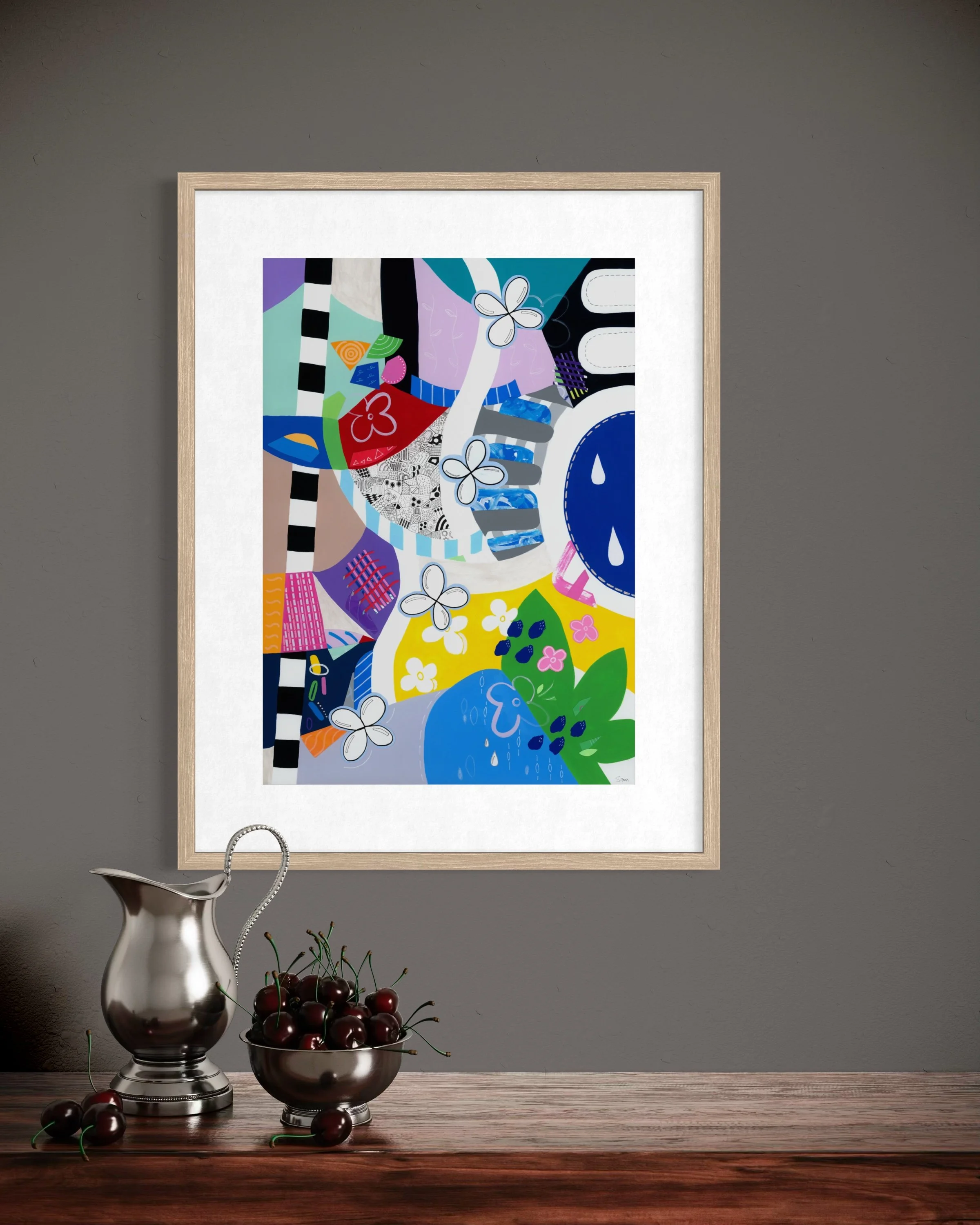 Crossing Currents fine art print displayed in a contemporary interior, showing a colourful abstract artwork with collage elements, patterned shapes, wave-like forms, flowers and organic details.