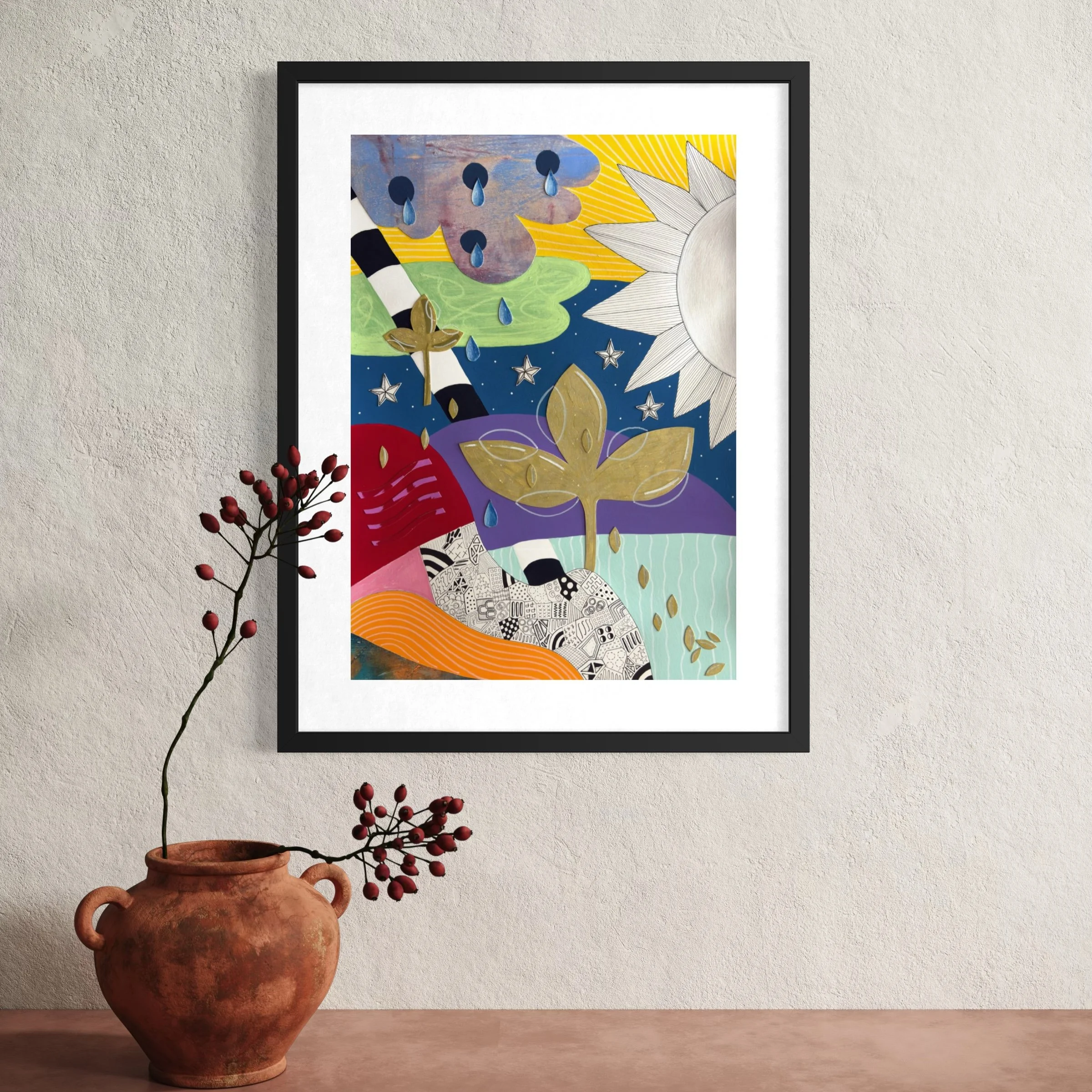 Tears To Gold, original mixed media abstract artwork on A3 paper featuring a sun, teardrops, stars, gold plant motifs and colourful sections, displayed framed in a modern interior.
