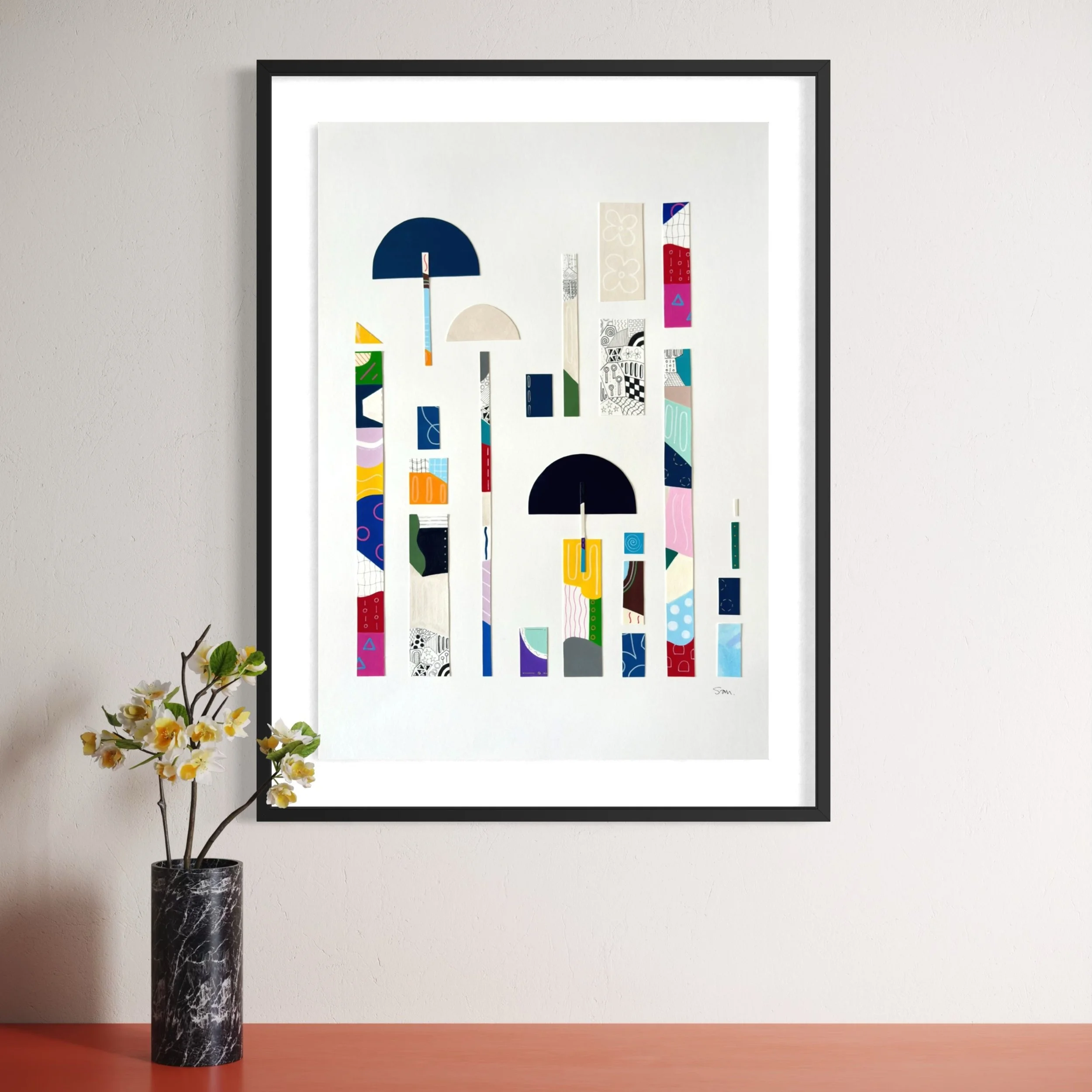 Between Play and Order, original mixed media on A2 paper with geometric and abstract forms, colour, pattern, and hand-drawn marks, styled in a modern interior.