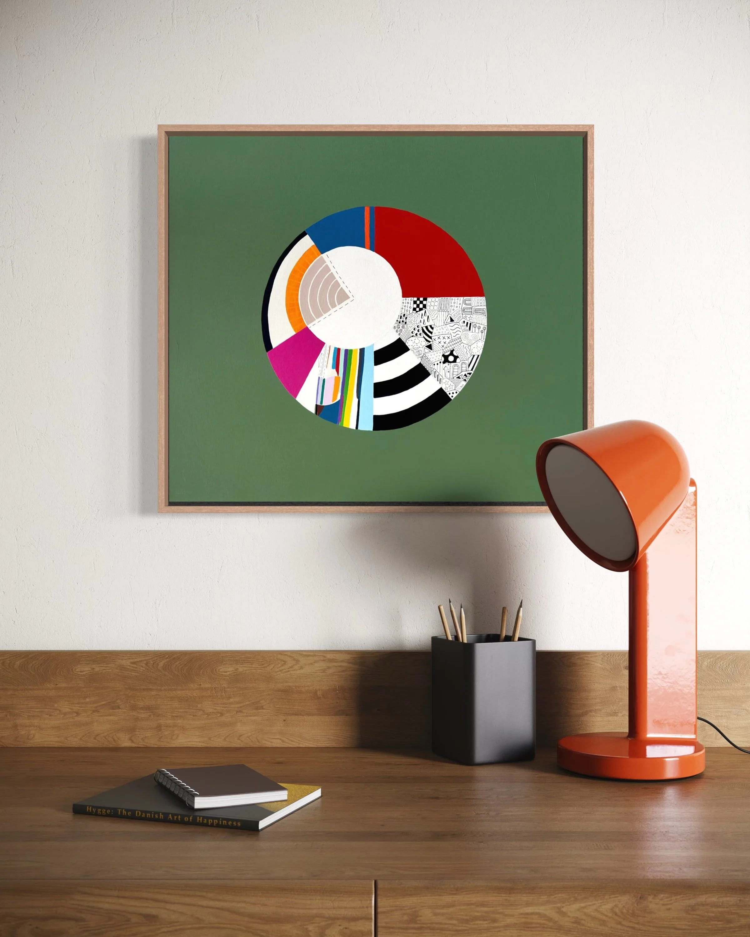 Off Centre, original abstract artwork on canvas with a colourful circular composition, radiating sections and an off-centre white circle on a jade green background, styled in a modern interior.