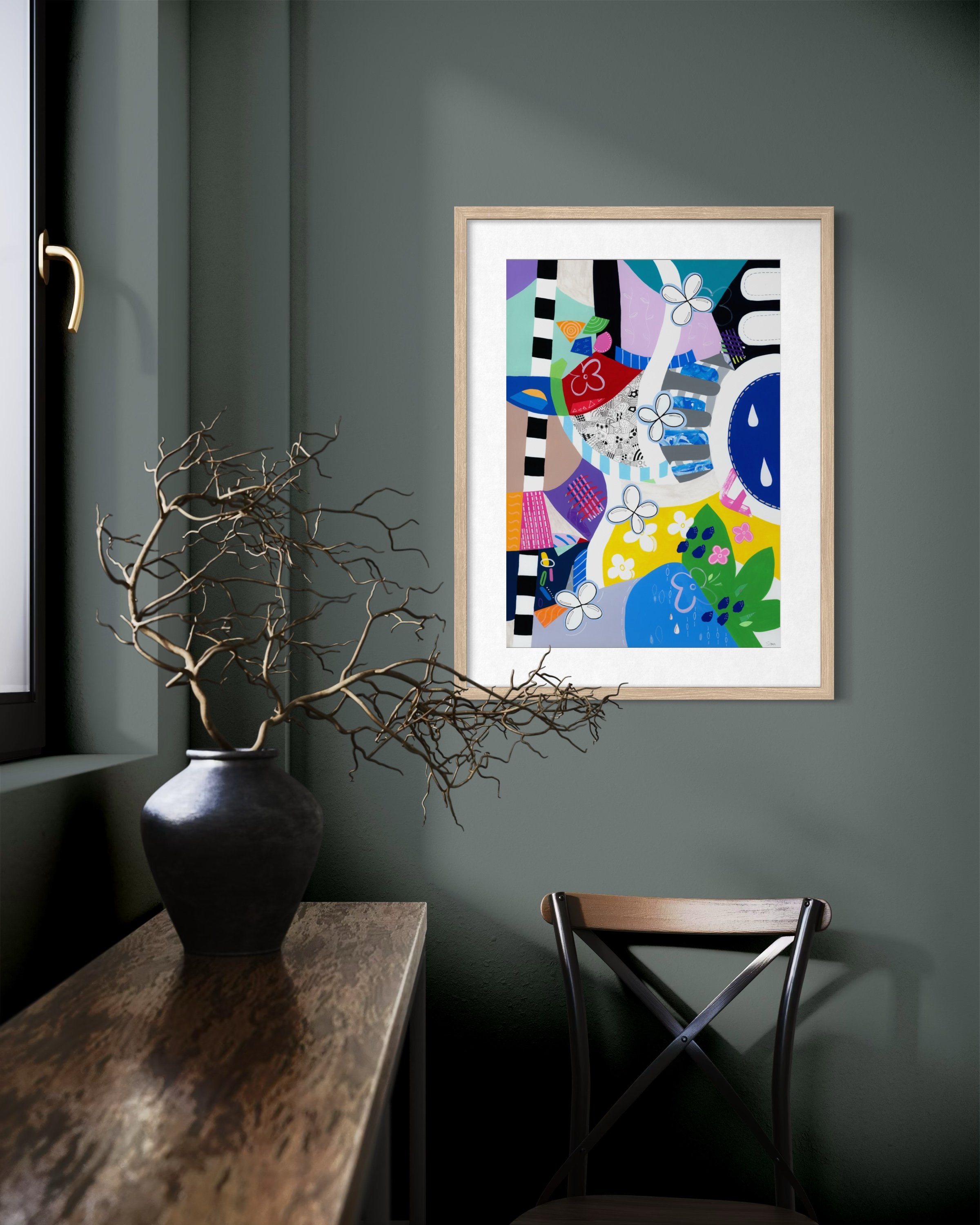 Crossing Currents fine art print displayed in a contemporary interior, showing a colourful abstract artwork with collage elements, patterned shapes, wave-like forms, flowers and organic details.