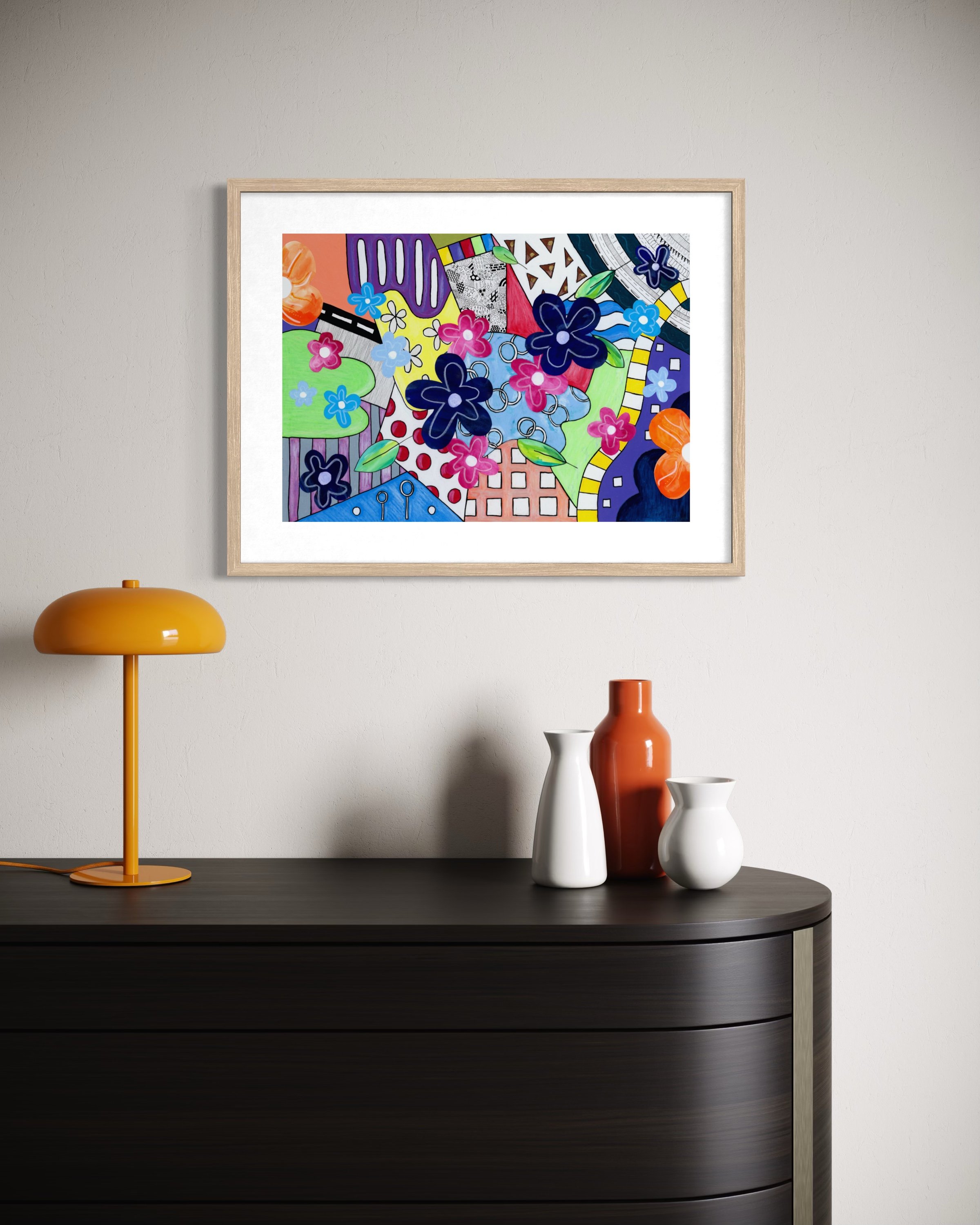Spring Breeze Overland fine art print in a contemporary interior, featuring bold colour sections, collage flowers, a winding path, road-like form, and playful hand-drawn details.