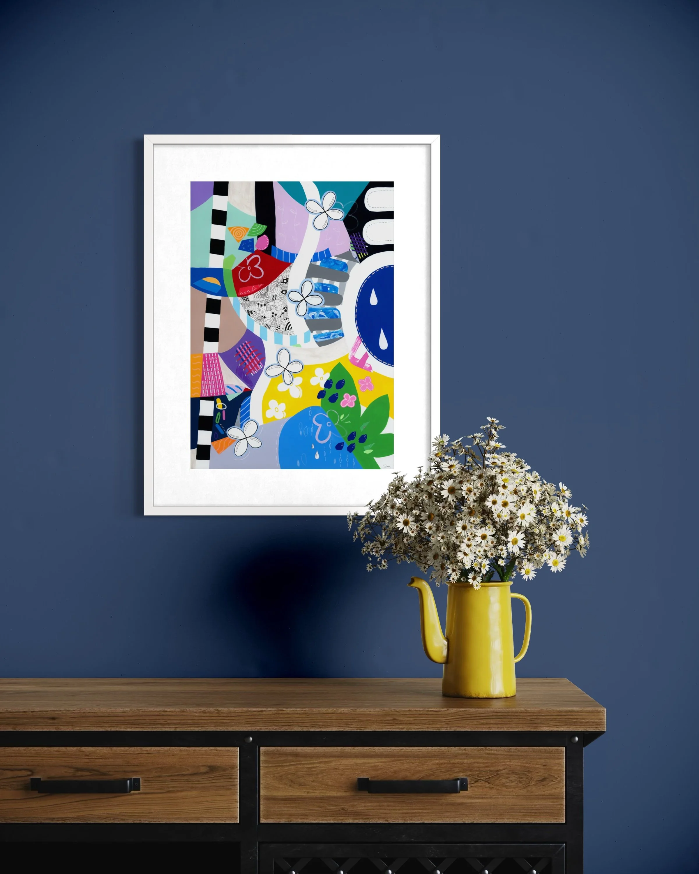 Crossing Currents fine art print displayed in a contemporary interior, showing a colourful abstract artwork with collage elements, patterned shapes, wave-like forms, flowers and organic details.