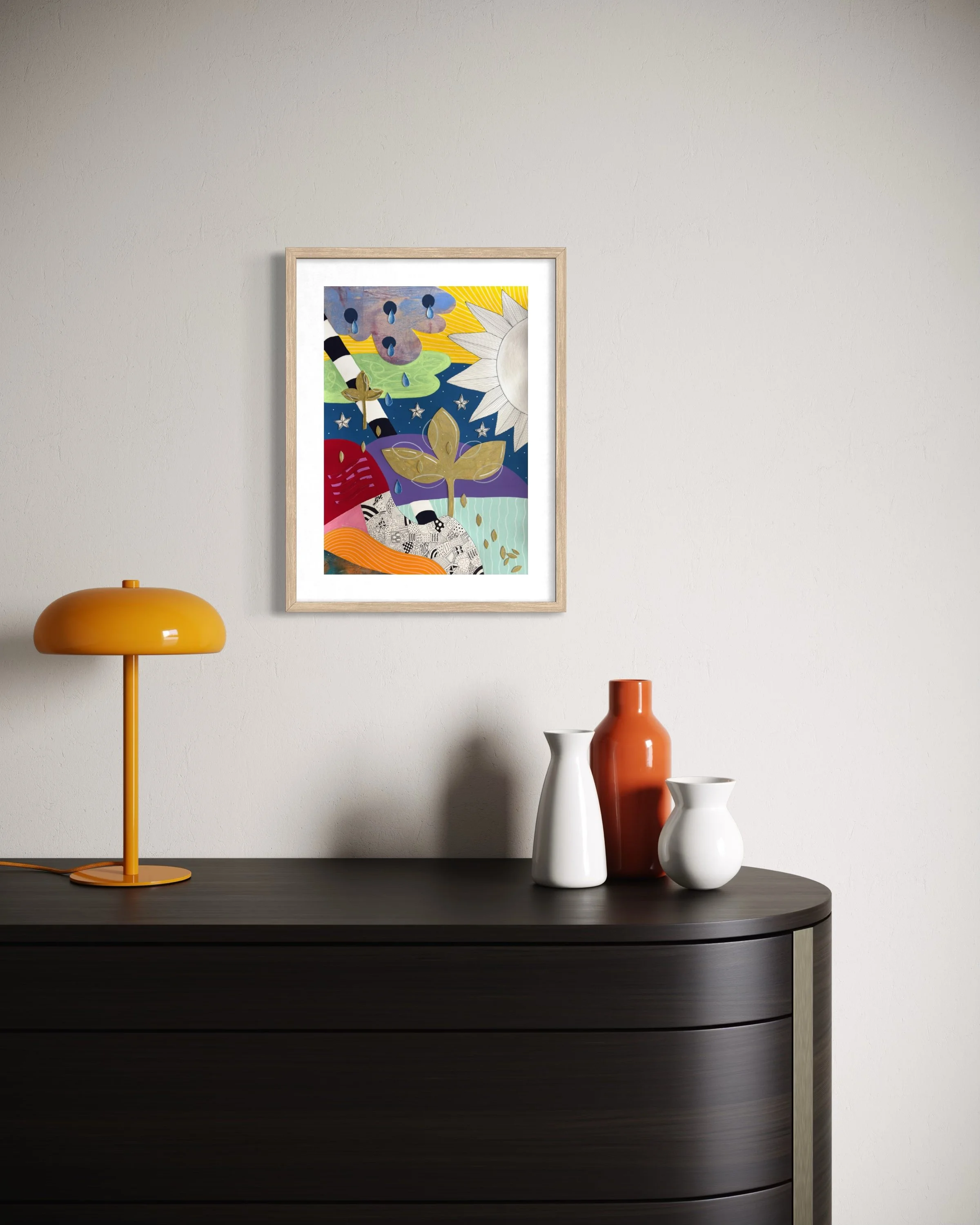 Tears To Gold, original mixed media abstract artwork on A3 paper featuring a sun, teardrops, stars, gold plant motifs and colourful sections, displayed framed in a modern interior.