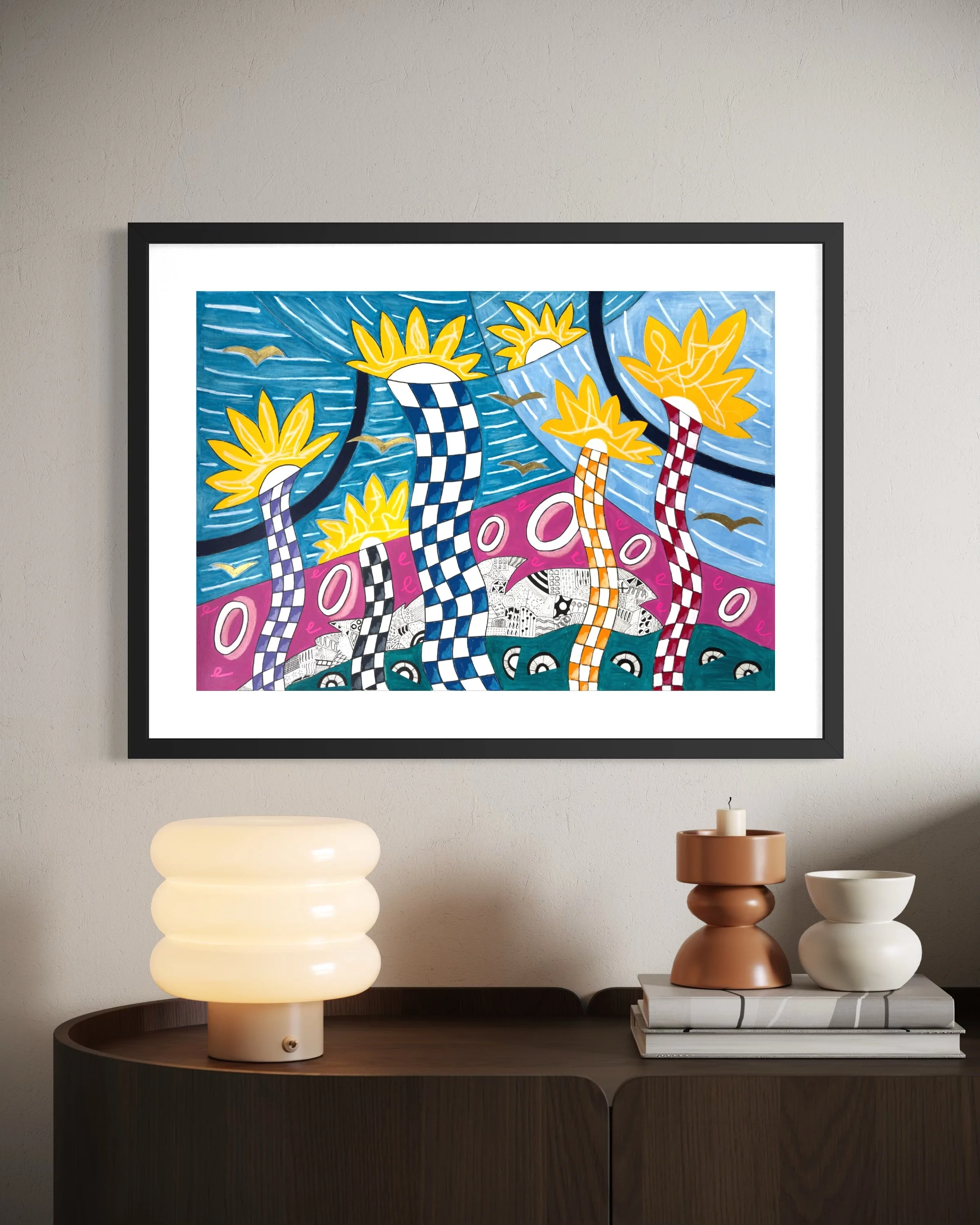 Dancing In The Car Yard, original mixed media artwork featuring colourful air dancer forms, bold patterns, expressive doodles, birds and cars, displayed framed in a modern interior.