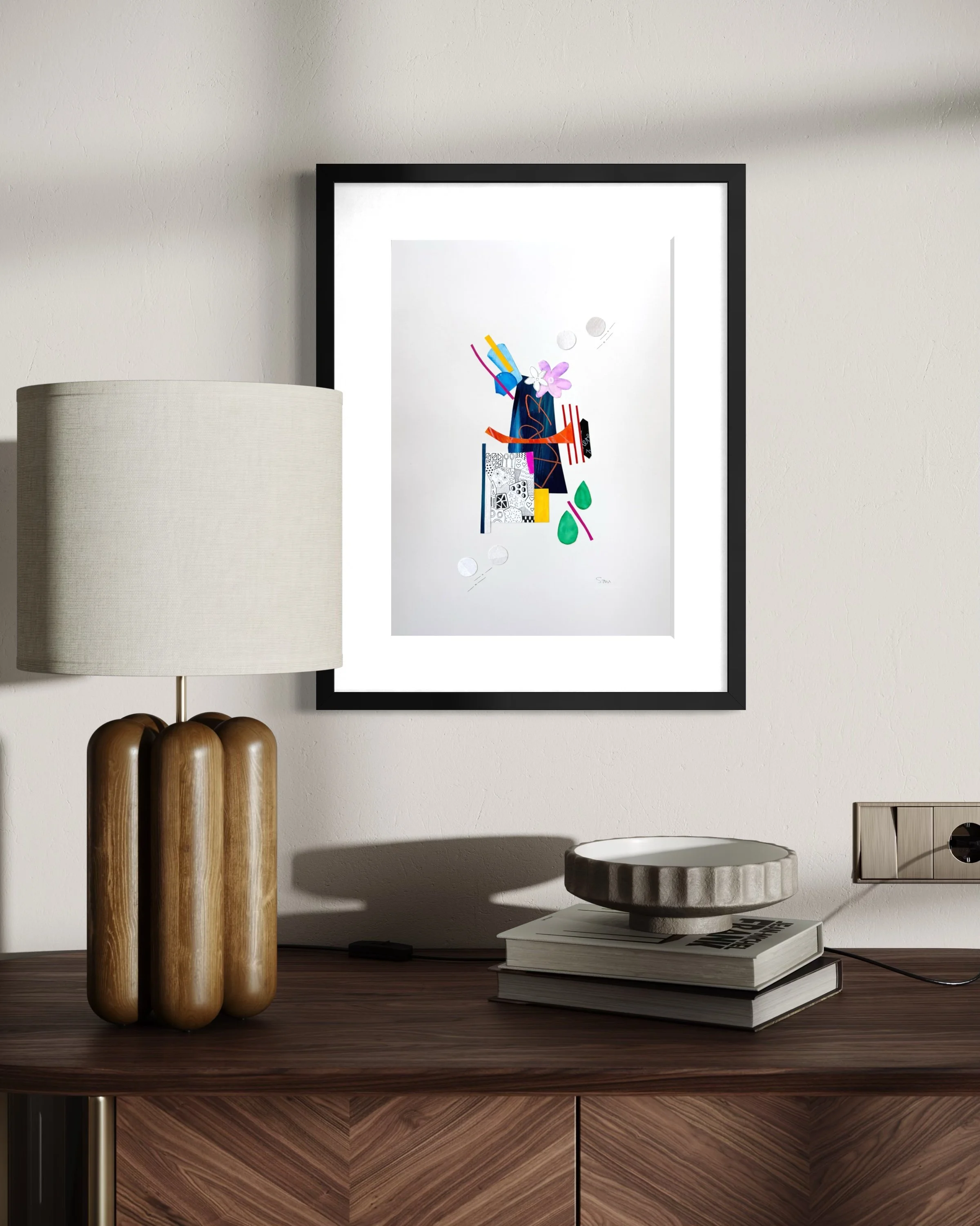 Bright Interruption, original mixed media collage on A3 paper featuring layered fragments, expressive marks, and bold abstract colour, and displayed framed in a modern interior.