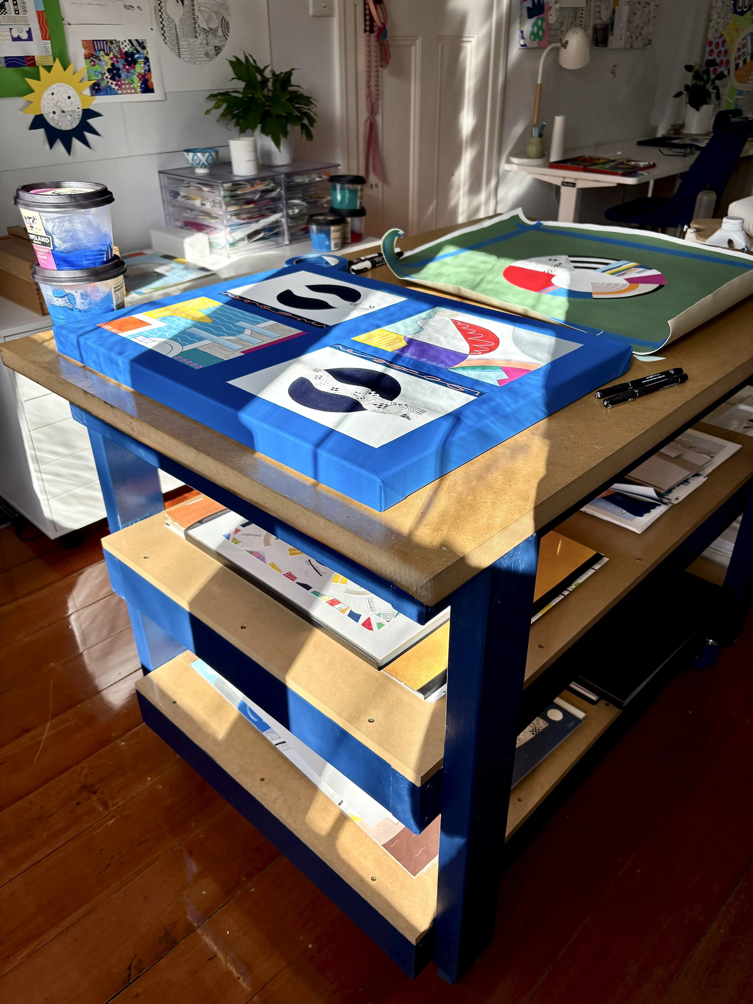 A couple of Sam Jackson's artworks on a workbench in her studio.