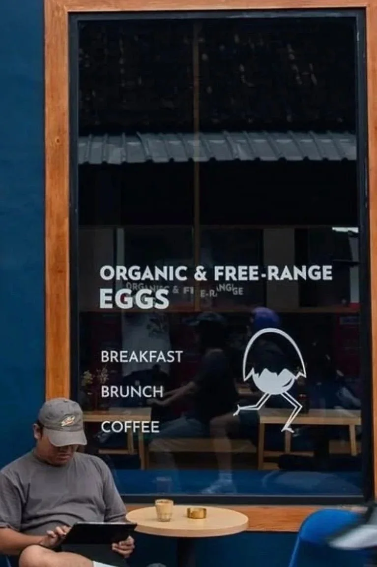 Outdoor seating at Studio Egg cafe in Peliatan Ubud Bali — relaxed minimal brunch space