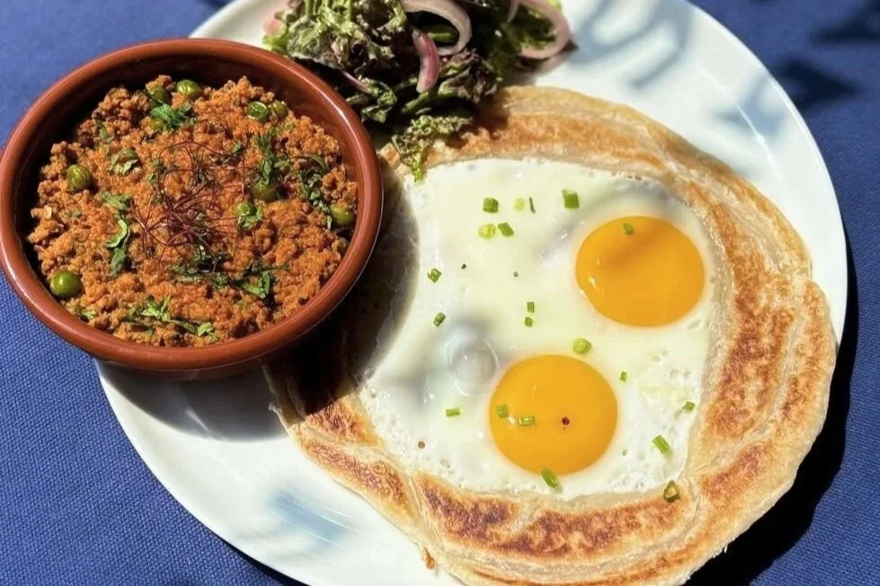 Chicken Keema Roti at Studio Egg Ubud Bali — minced chicken keema with paratha, chicken eggs and pickled onion salad