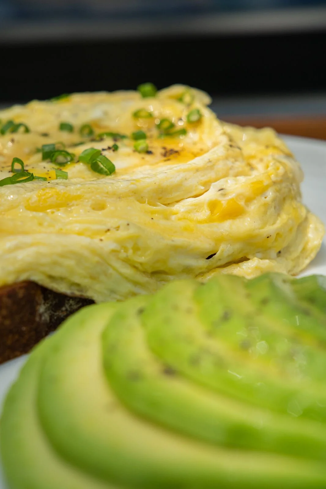 Velvet Egg Avocado at Studio Egg Ubud Bali — velvet cage-free eggs with fresh sliced avocado on ancient grain sourdough toast