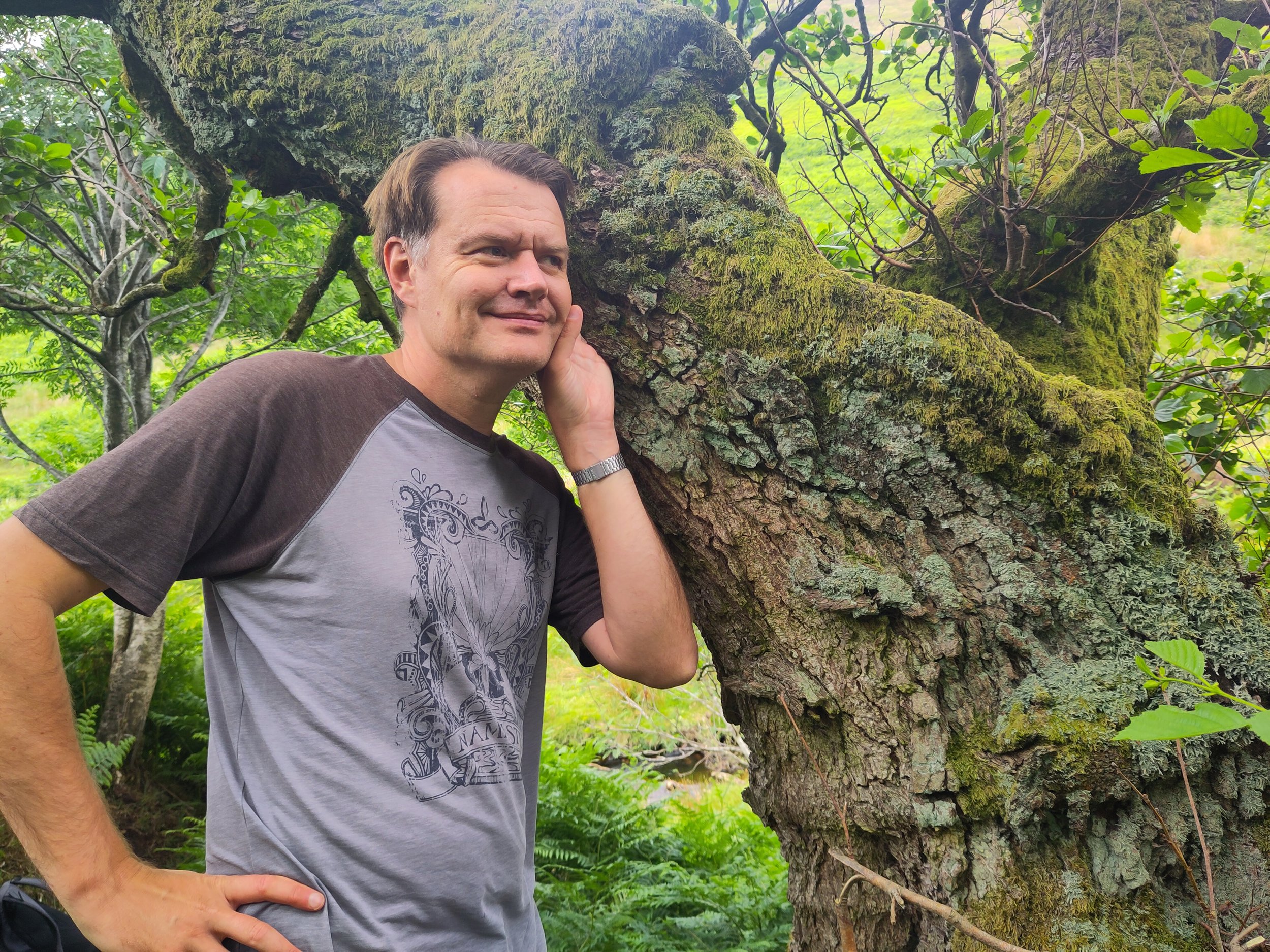 Ben listens to a tree