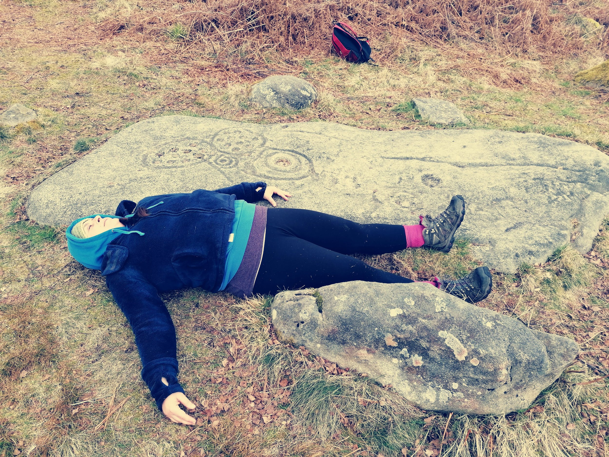 Lying beside (replica) ancient rock art
