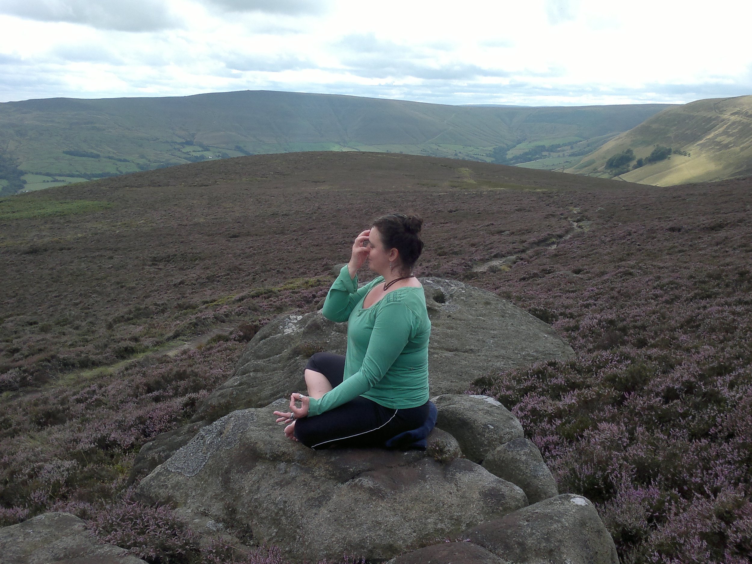 Jo practicing Nadi Shodhana on Kinder above Edale