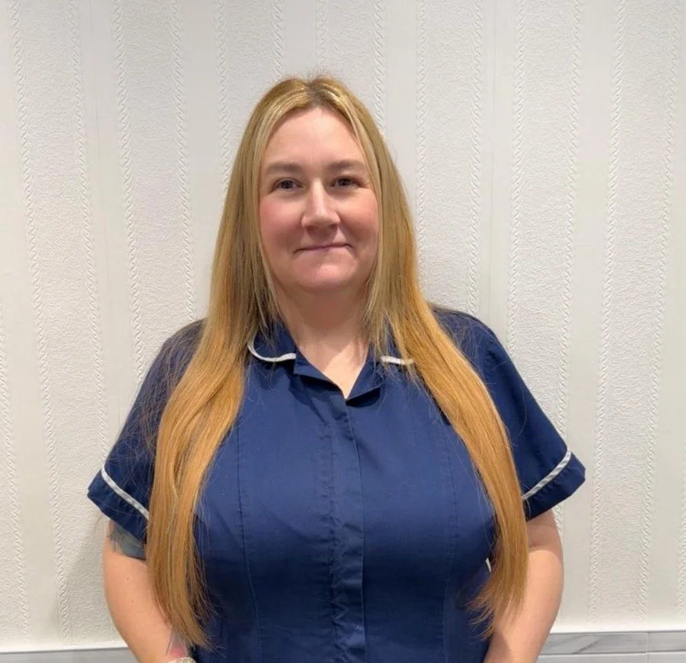  Silhouette of a woman with shoulder-length hair, no facial features visible.