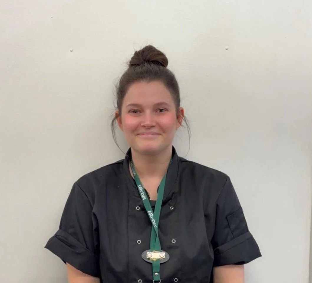 Simple gray silhouette of a woman with shoulder-length hair on a light background.