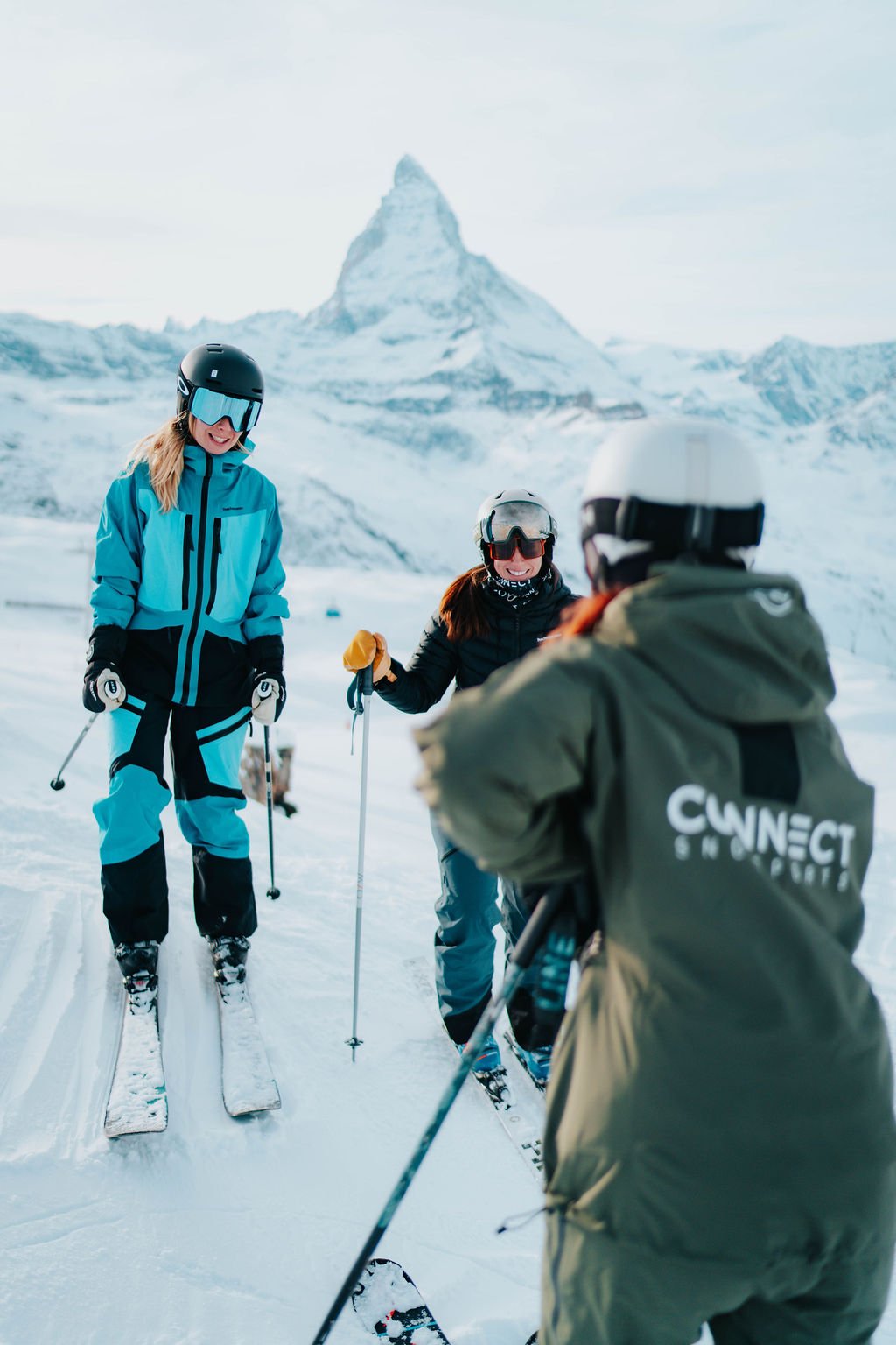 Women developing their skiing skills in a coached group lesson in Zermatt