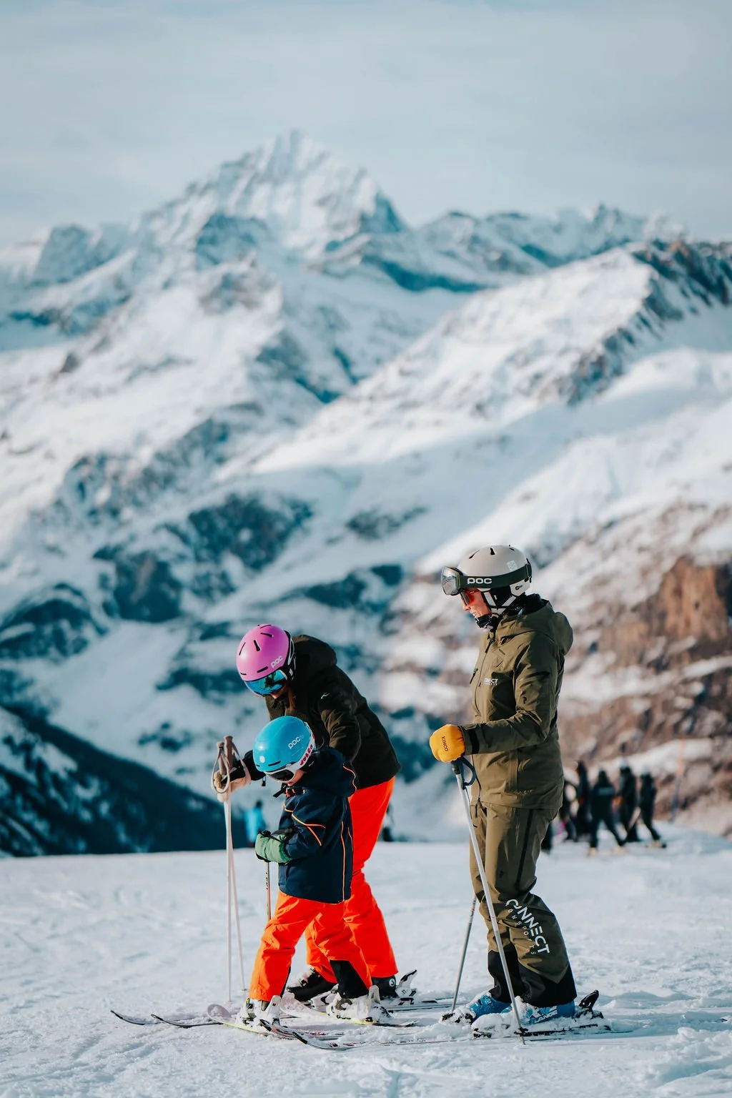 Ski instructor with family during a private ski lesson in Zermatt Switzerland
